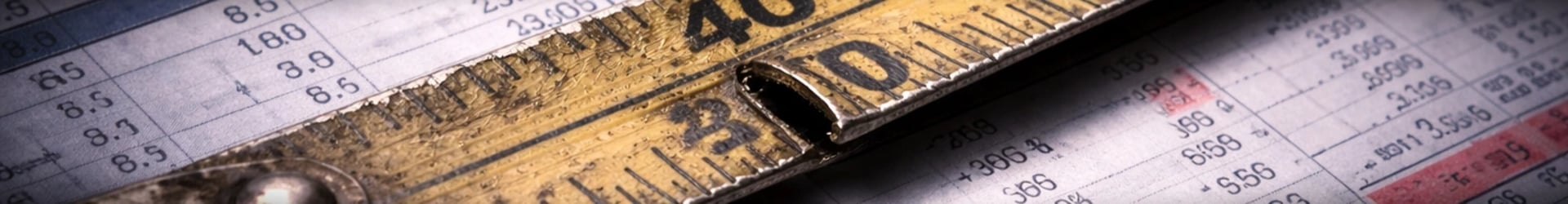 Measuring tape over financial data highlighting how business performance metrics can distort reality