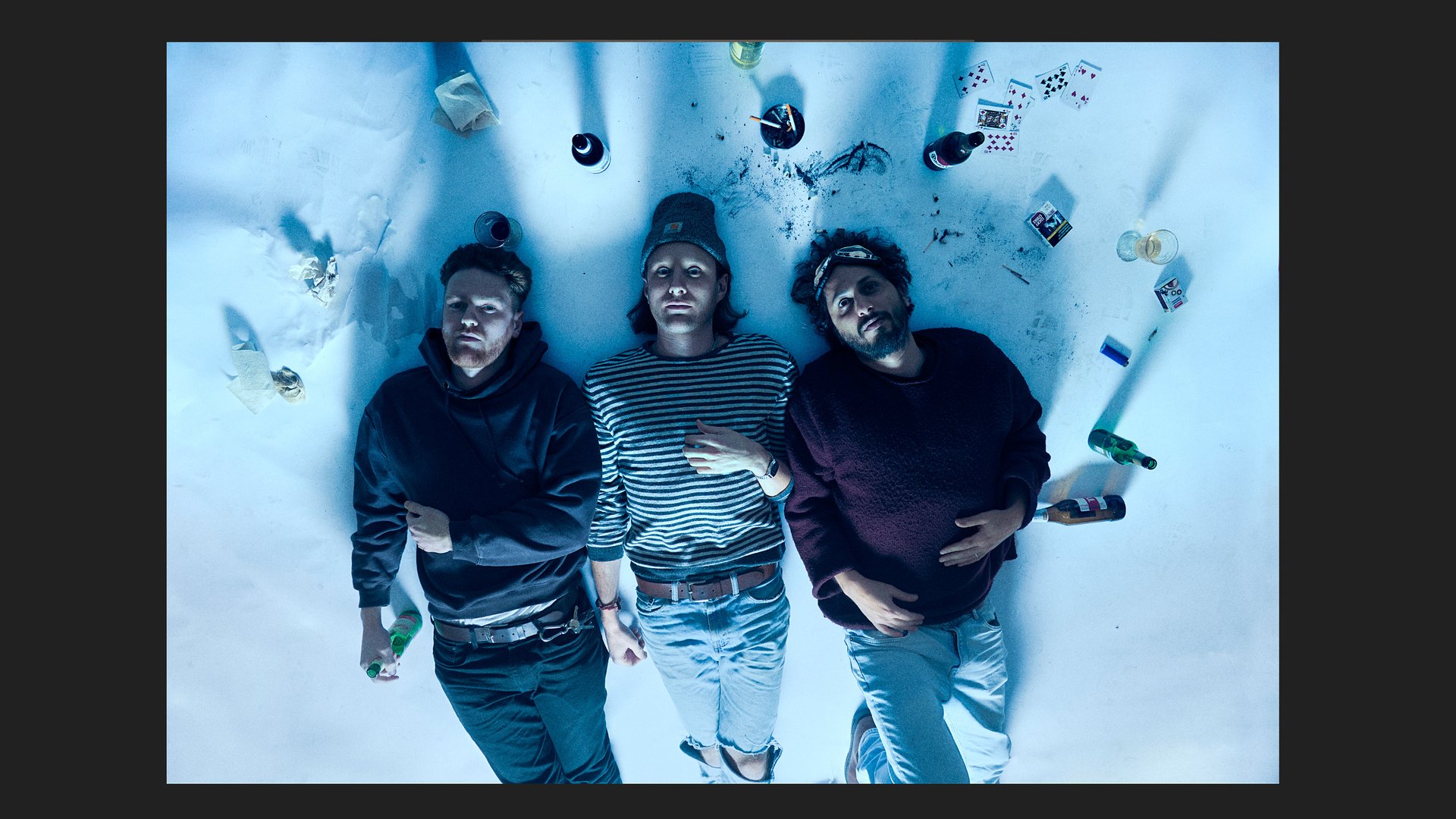 Glider band members lying on a dirty white paper.