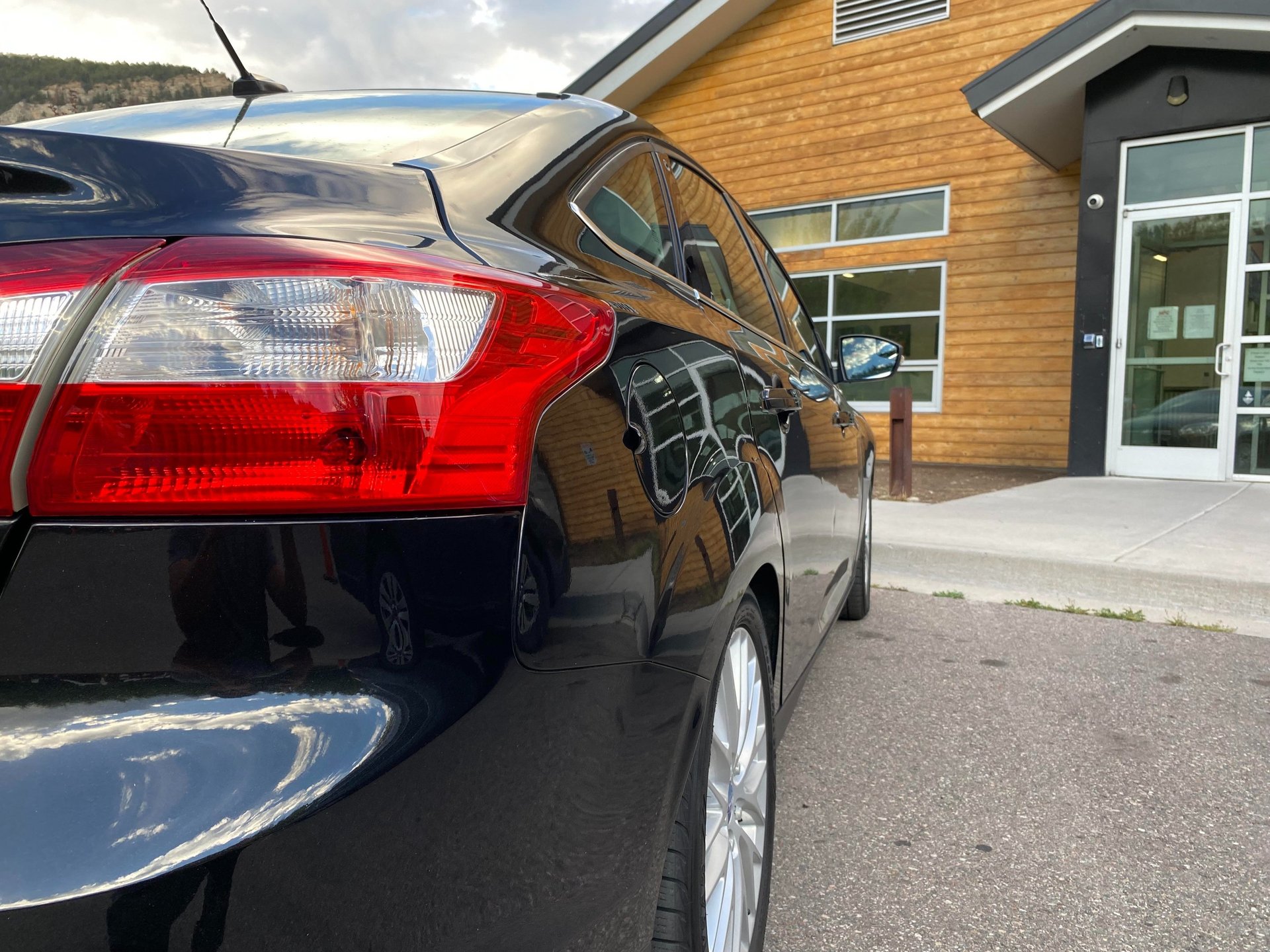 Mobile auto detailing specialist cleaning the exterior with a foam cannon for a deep, professional wash and interior cleaning