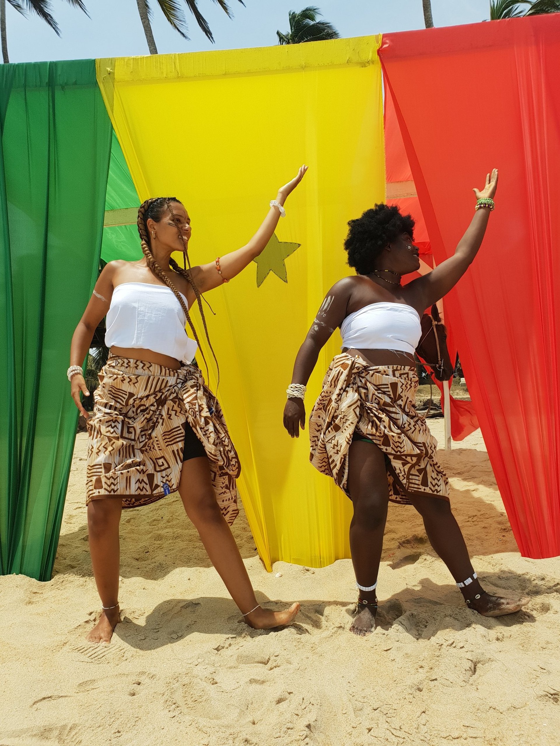 woman wearing yellow long-sleeved dress under white clouds and blue sky during daytime