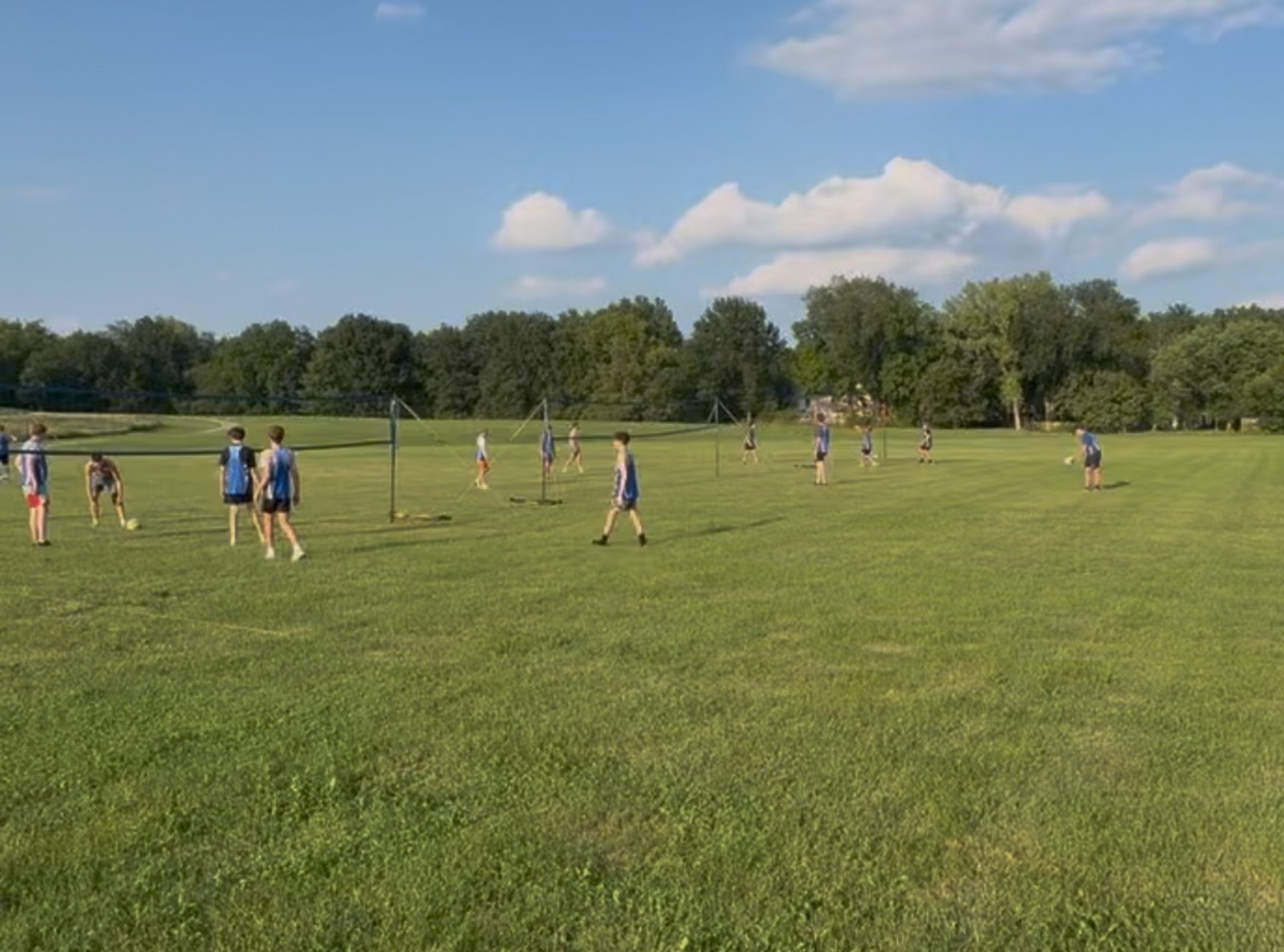 an abstract photo of a curved building with a blue sky in the background