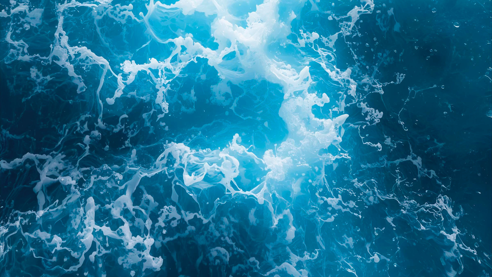 a large wave in the middle of the ocean