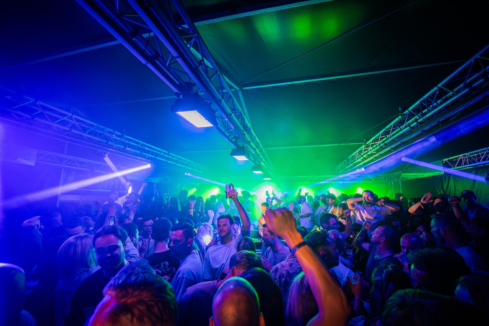 an abstract photo of a curved building with a blue sky in the background