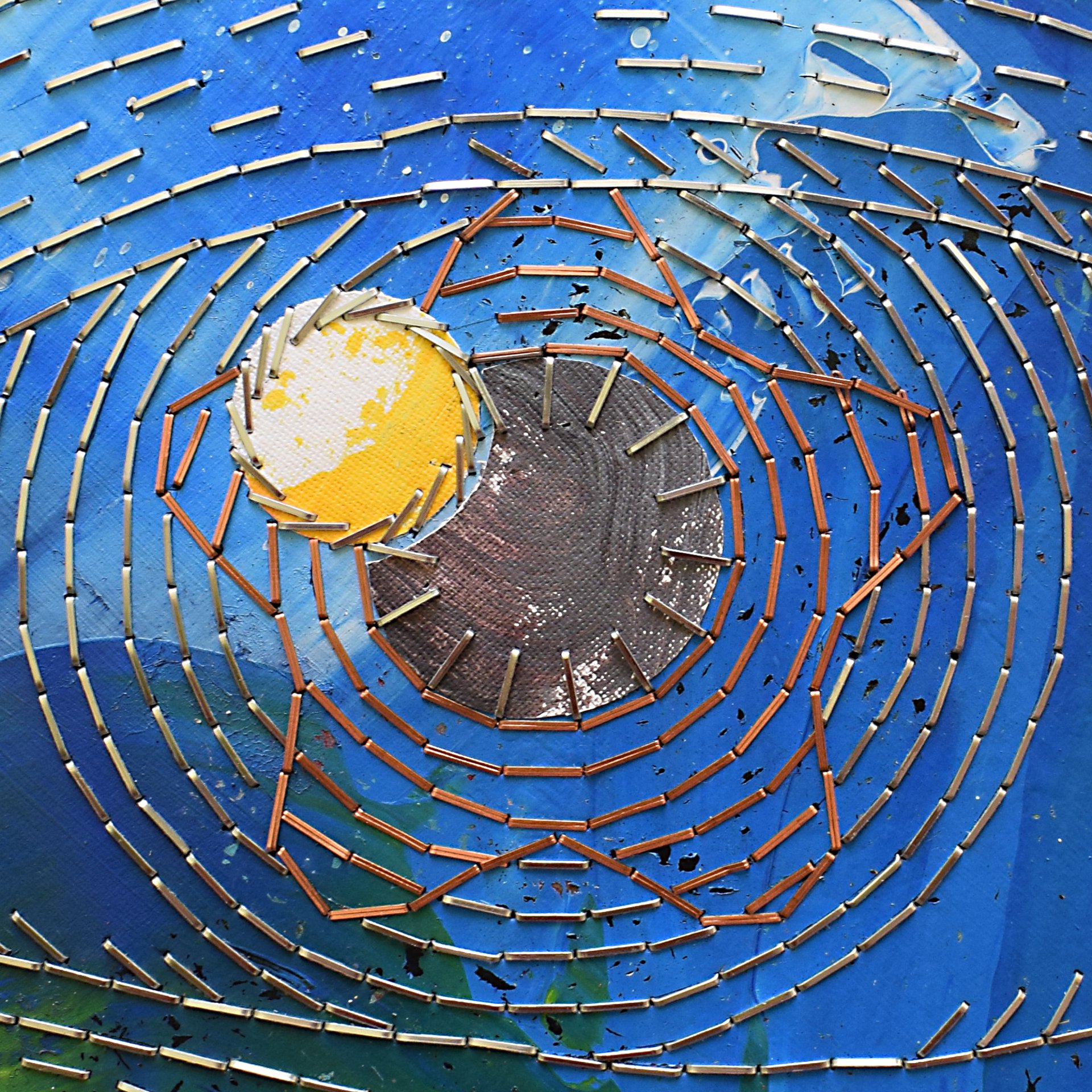 an abstract photo of a curved building with a blue sky in the background