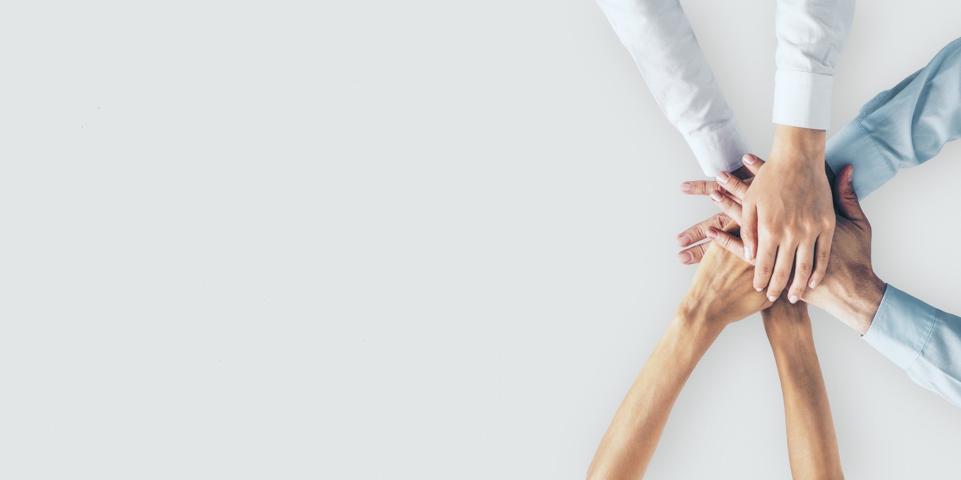 person in black long sleeve shirt holding persons hand
