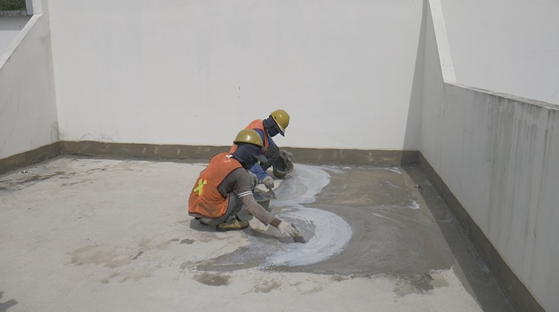 an abstract photo of a curved building with a blue sky in the background