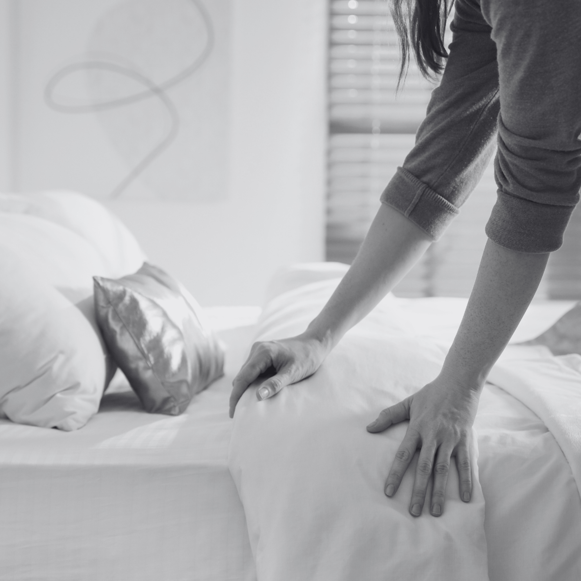 a living room filled with furniture and a kitchen