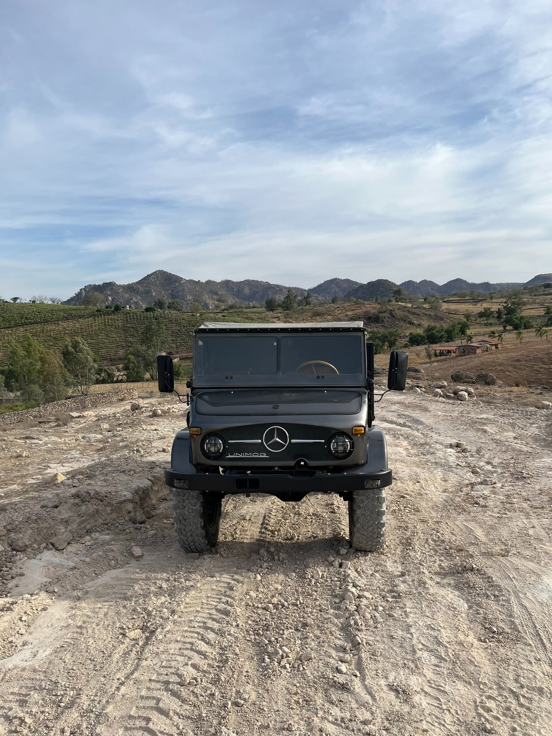 woman wearing yellow long-sleeved dress under white clouds and blue sky during daytime