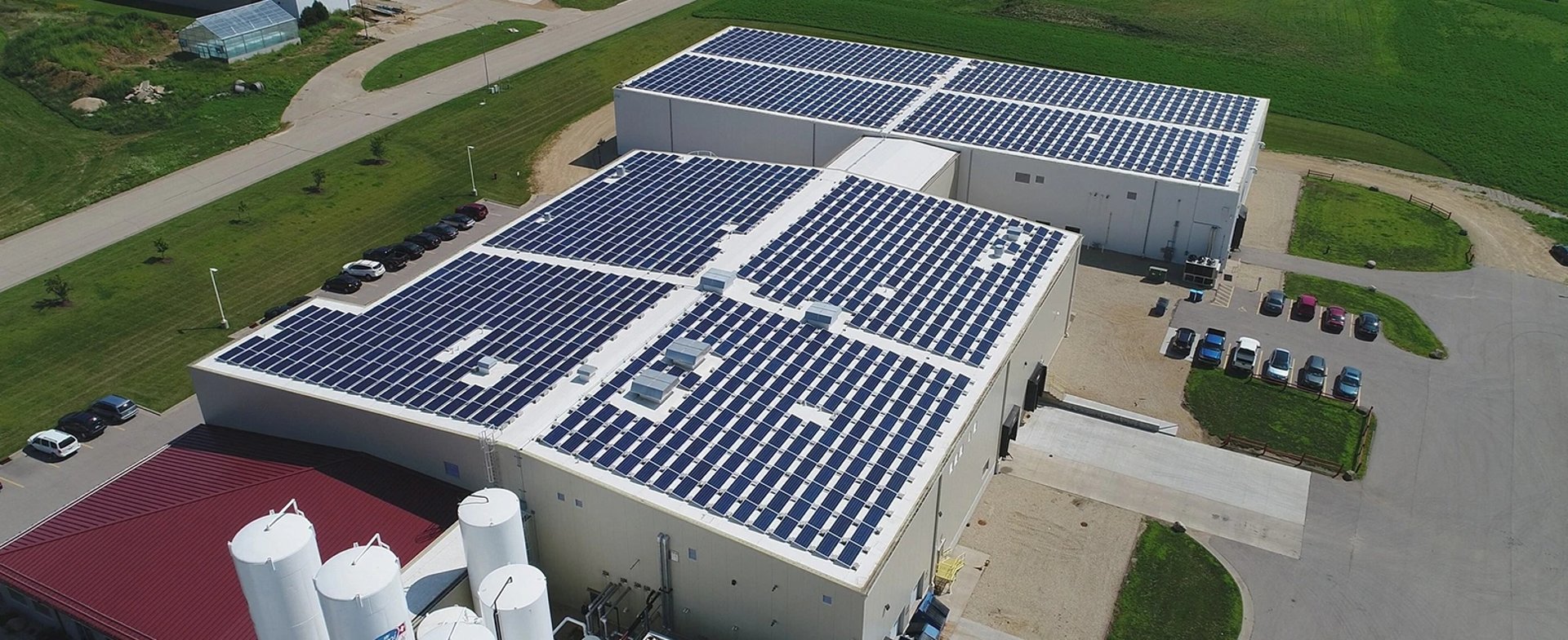an abstract photo of a curved building with a blue sky in the background