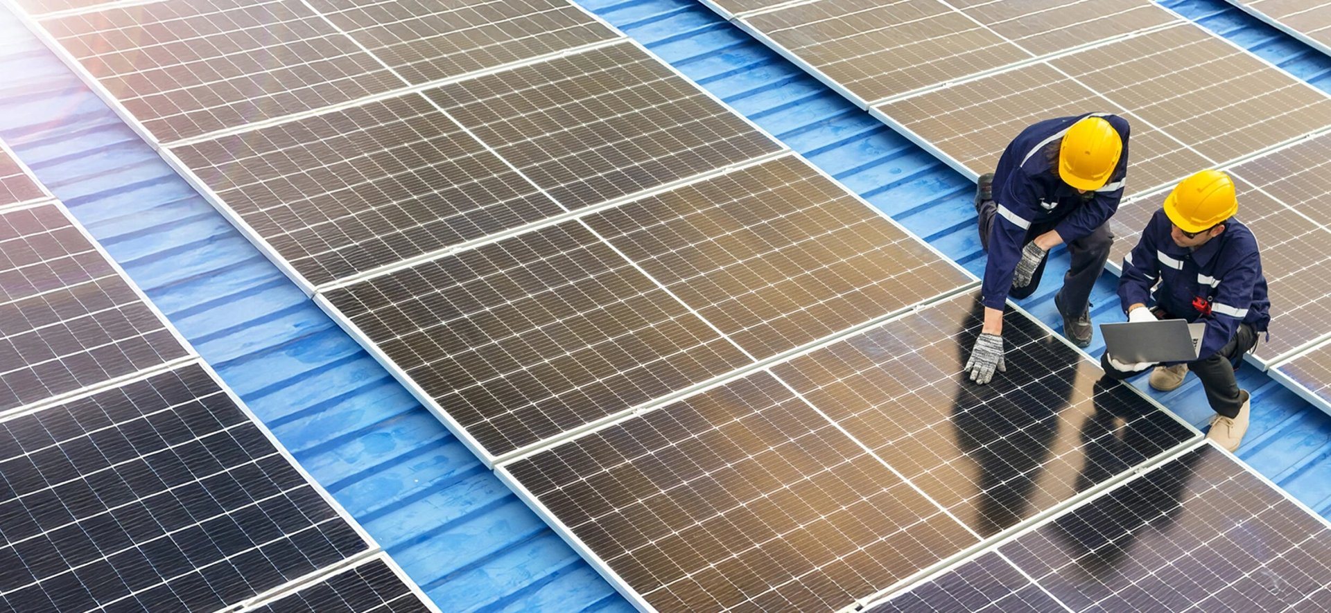 an abstract photo of a curved building with a blue sky in the background