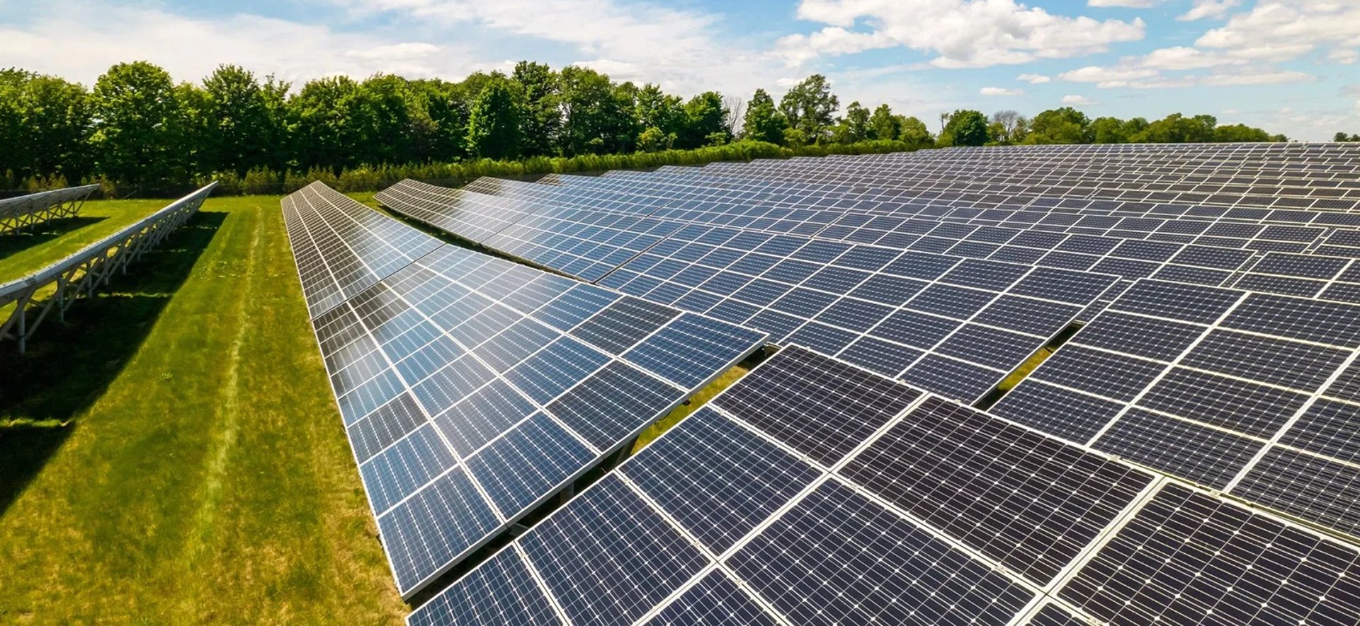 an abstract photo of a curved building with a blue sky in the background