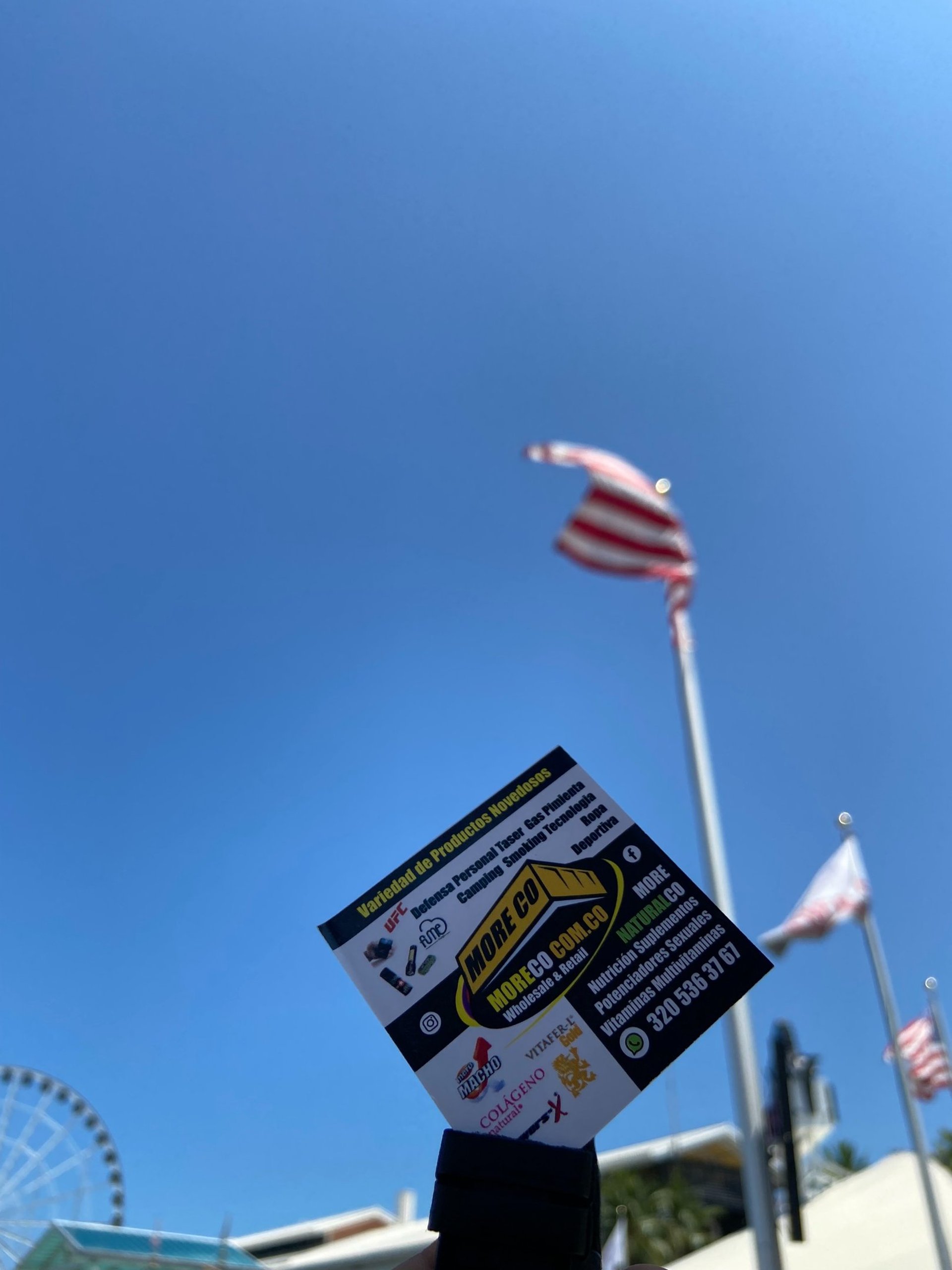 an abstract photo of a curved building with a blue sky in the background