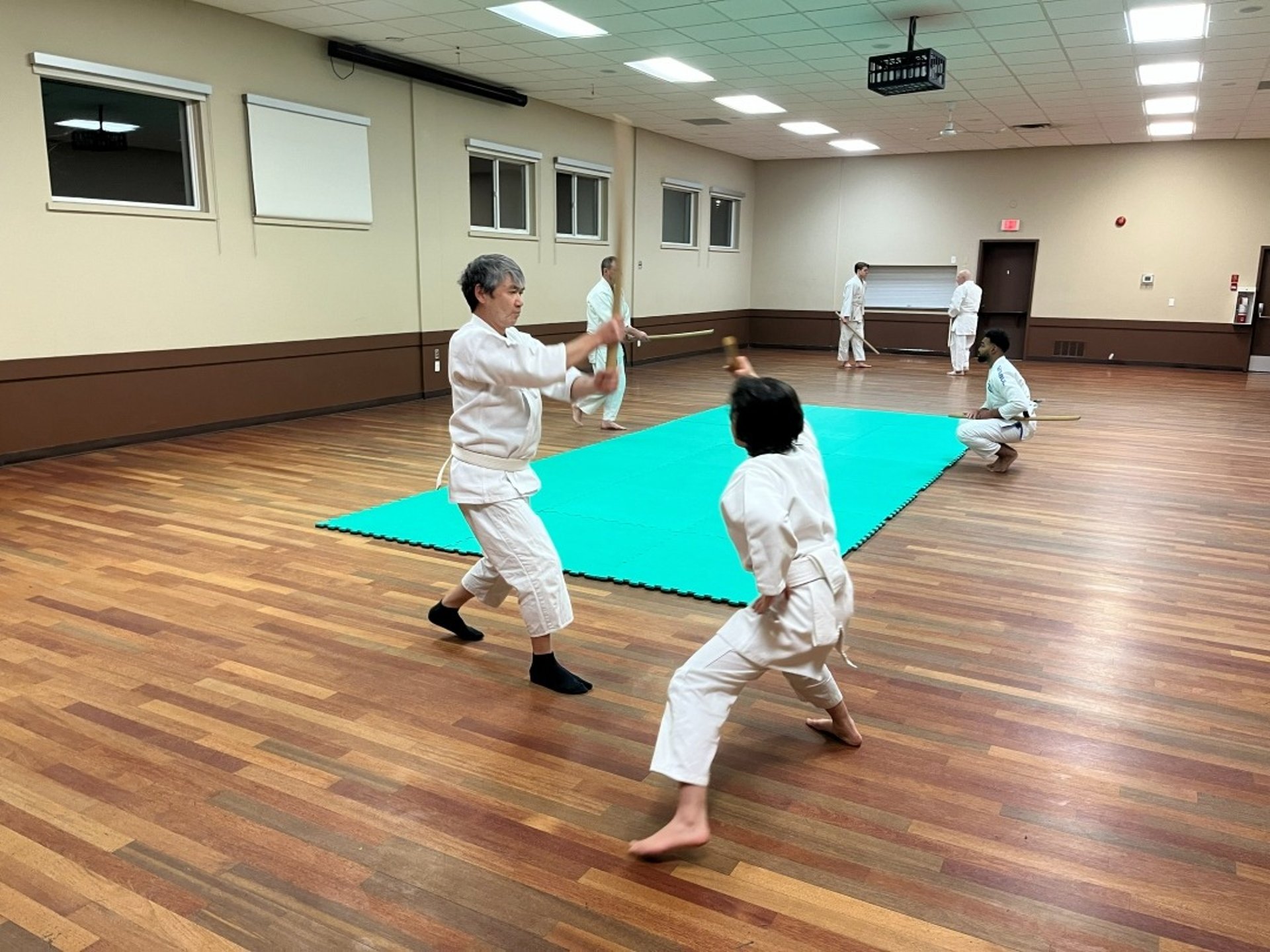 teens and adults practicing japanese sword at the Mount Pleasant hall