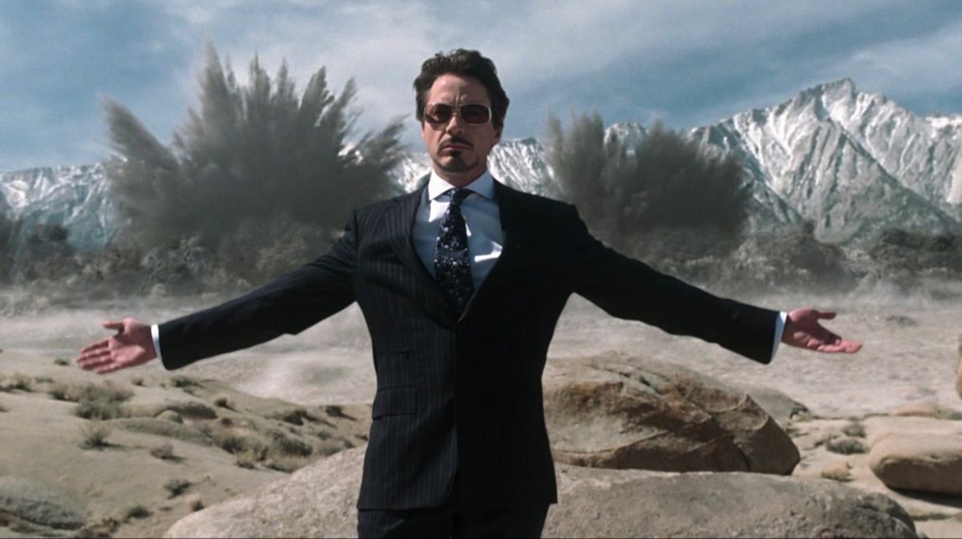 a man is holding his hair in the air