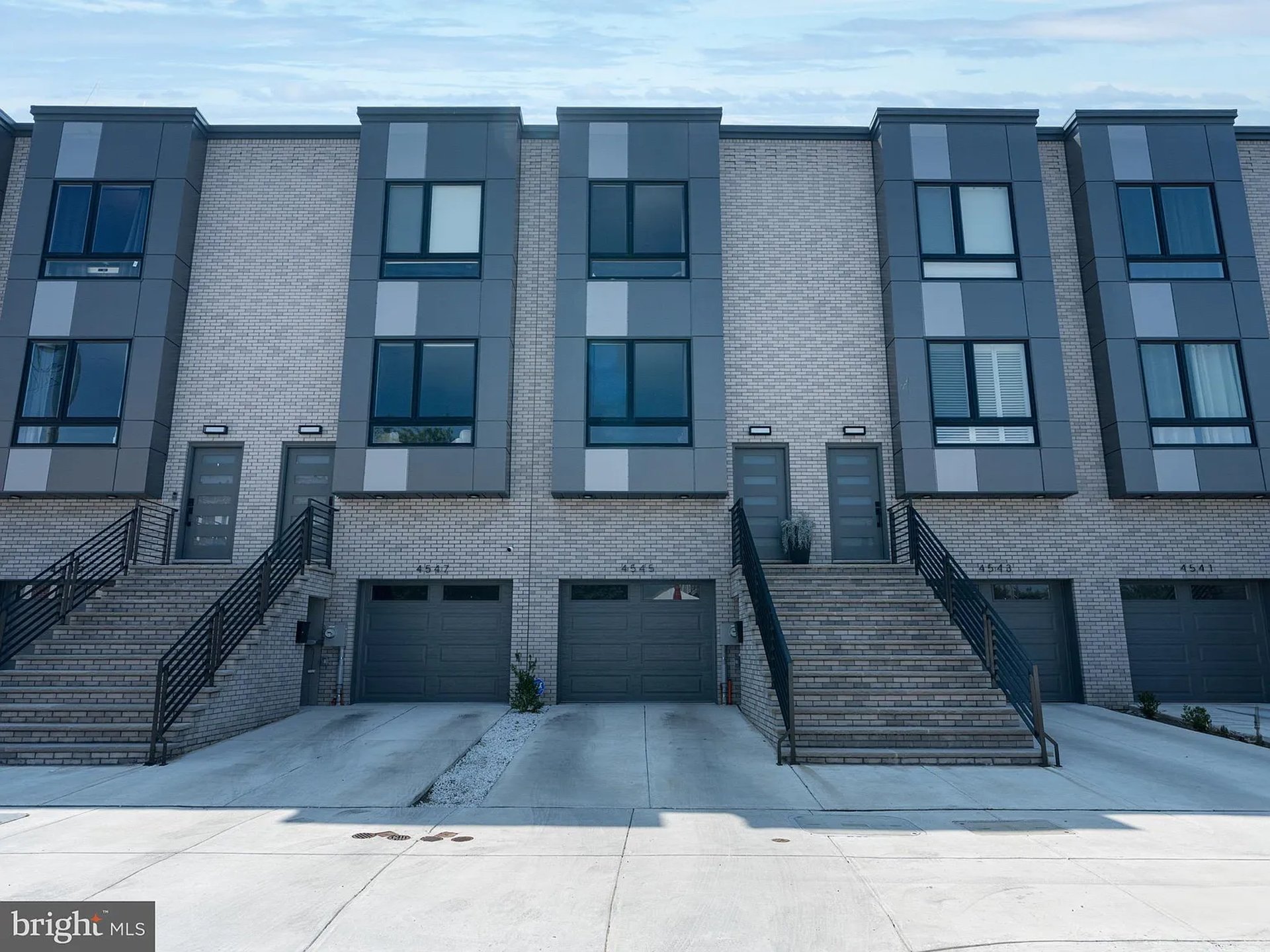 black and brown leather padded tub sofa