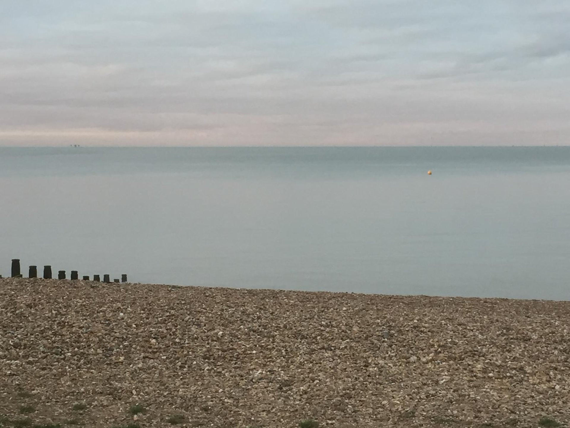 woman wearing yellow long-sleeved dress under white clouds and blue sky during daytime