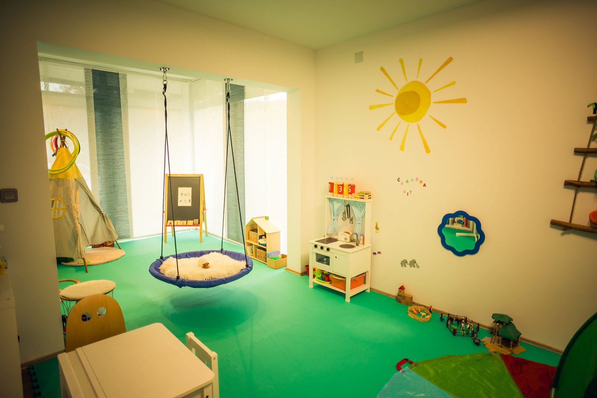 two women lying on hammock