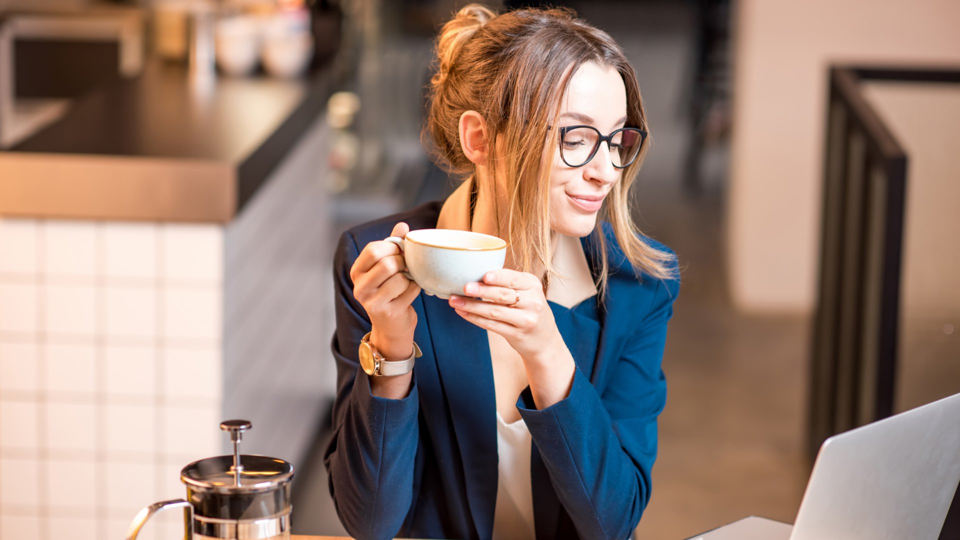 an abstract photo of a curved building with a blue sky in the background