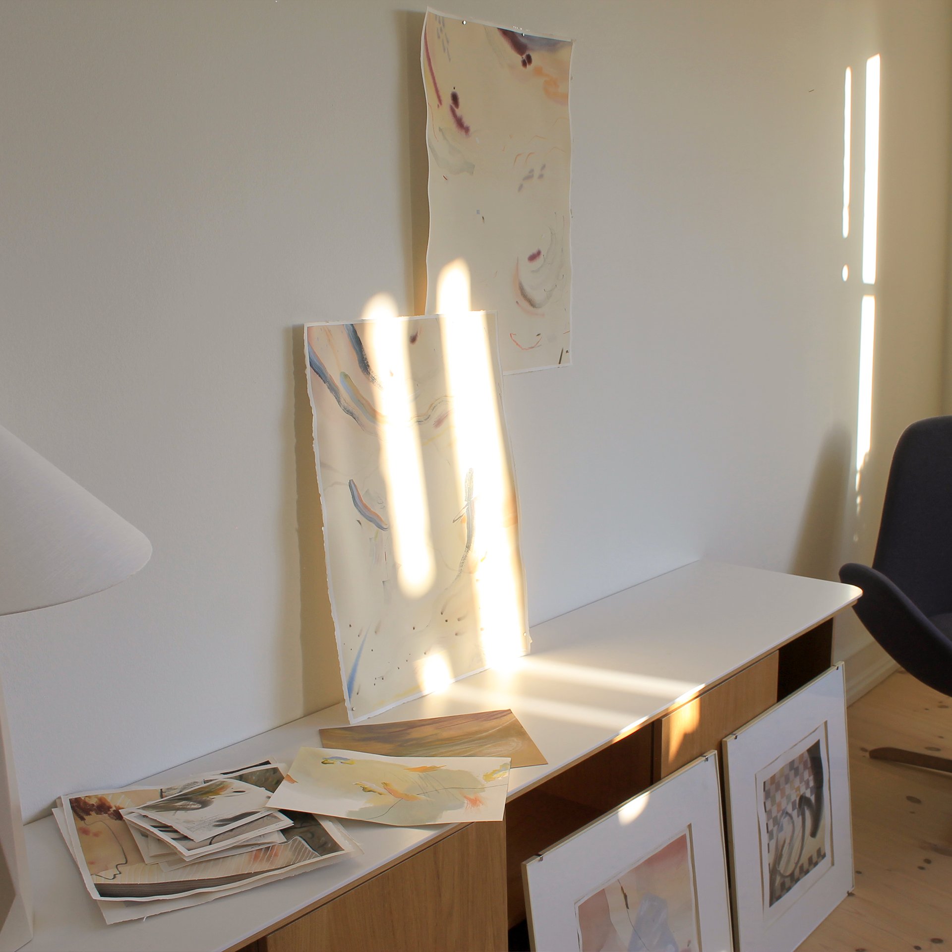 an abstract photo of a curved building with a blue sky in the background
