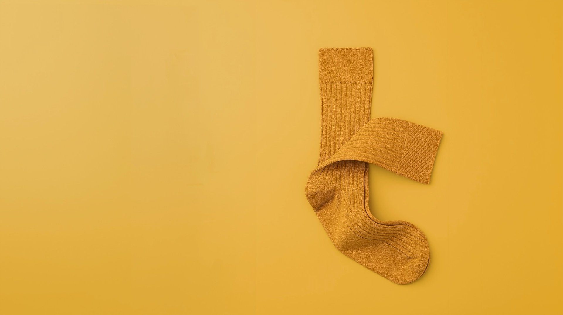 a pair of socks laying on top of a yellow surface