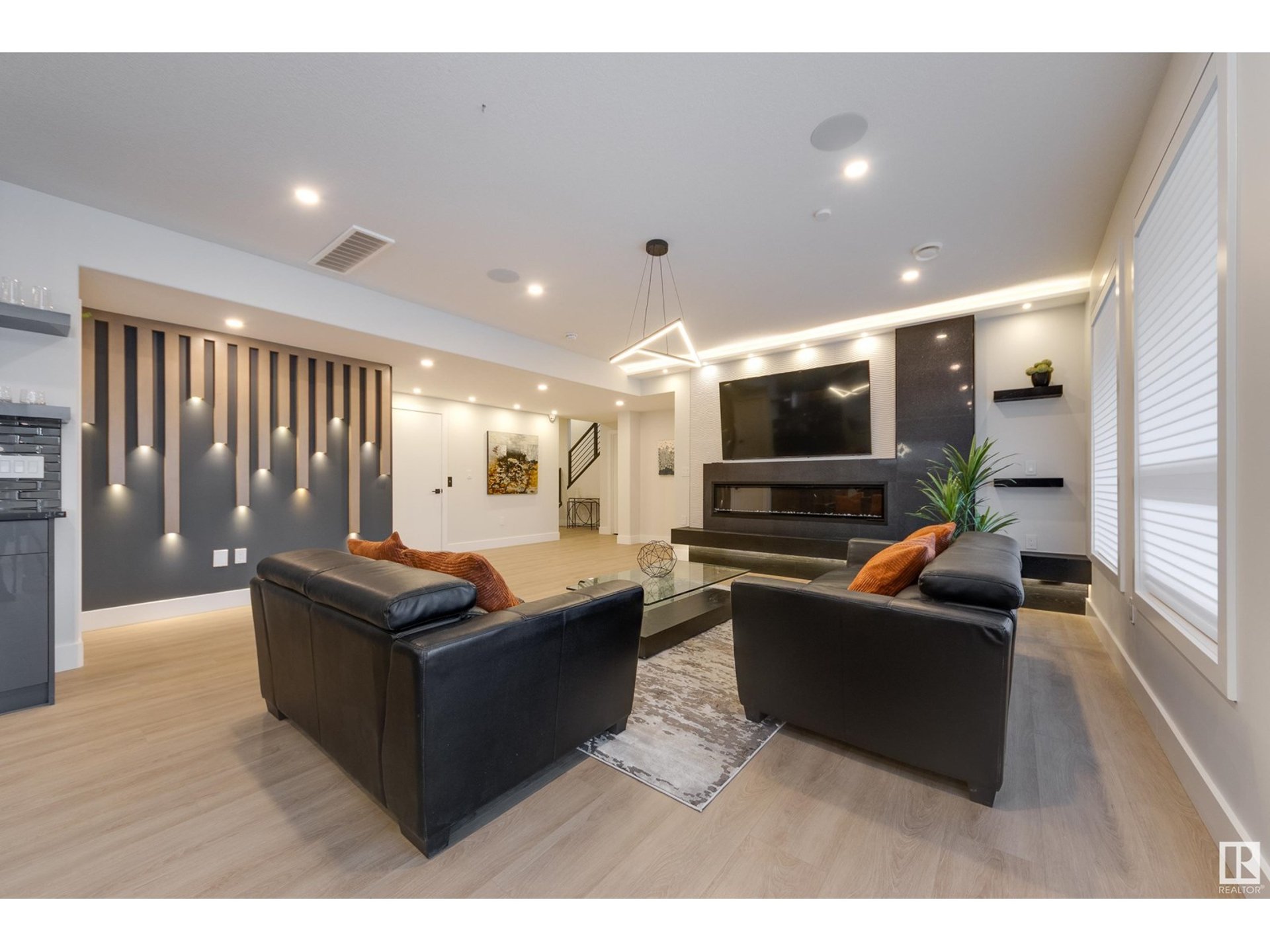 black and brown leather padded tub sofa