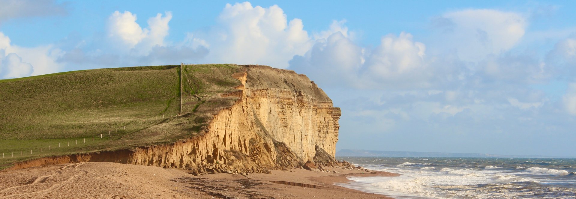 black and brown leather padded tub sofa