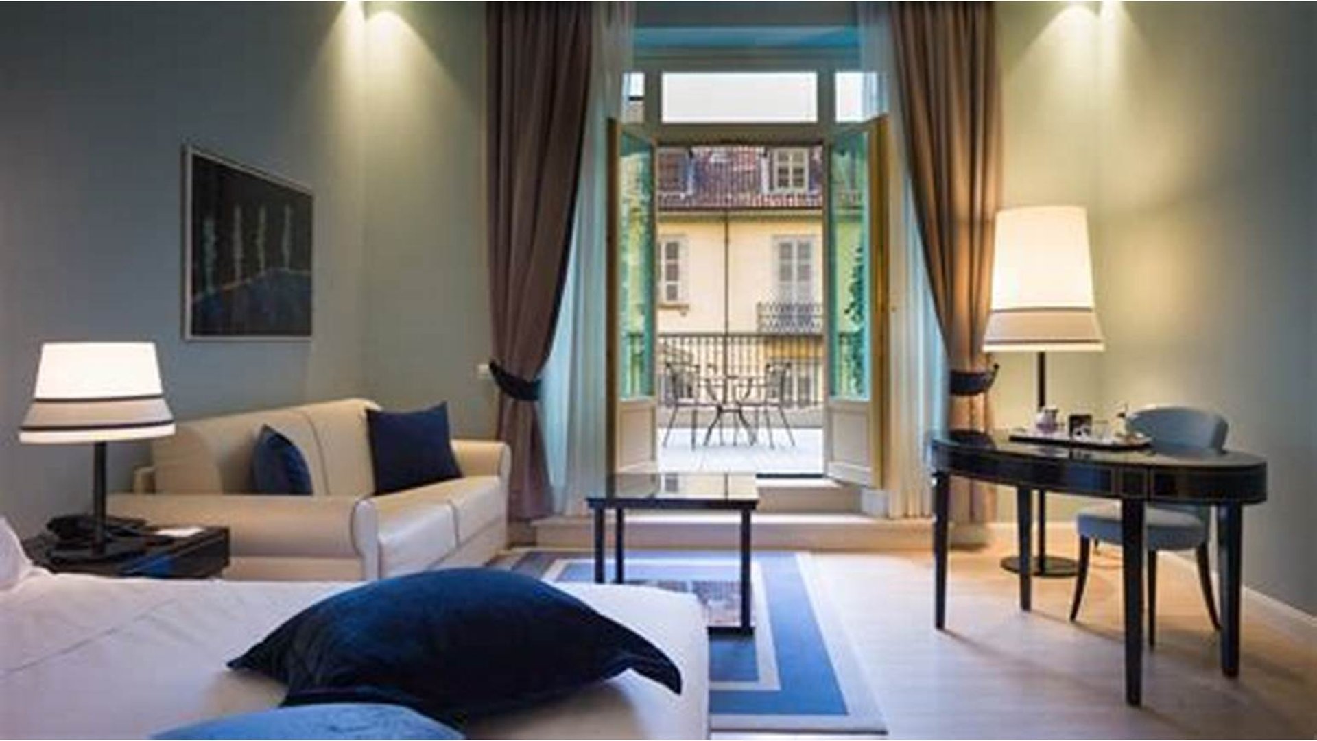 an abstract photo of a curved building with a blue sky in the background