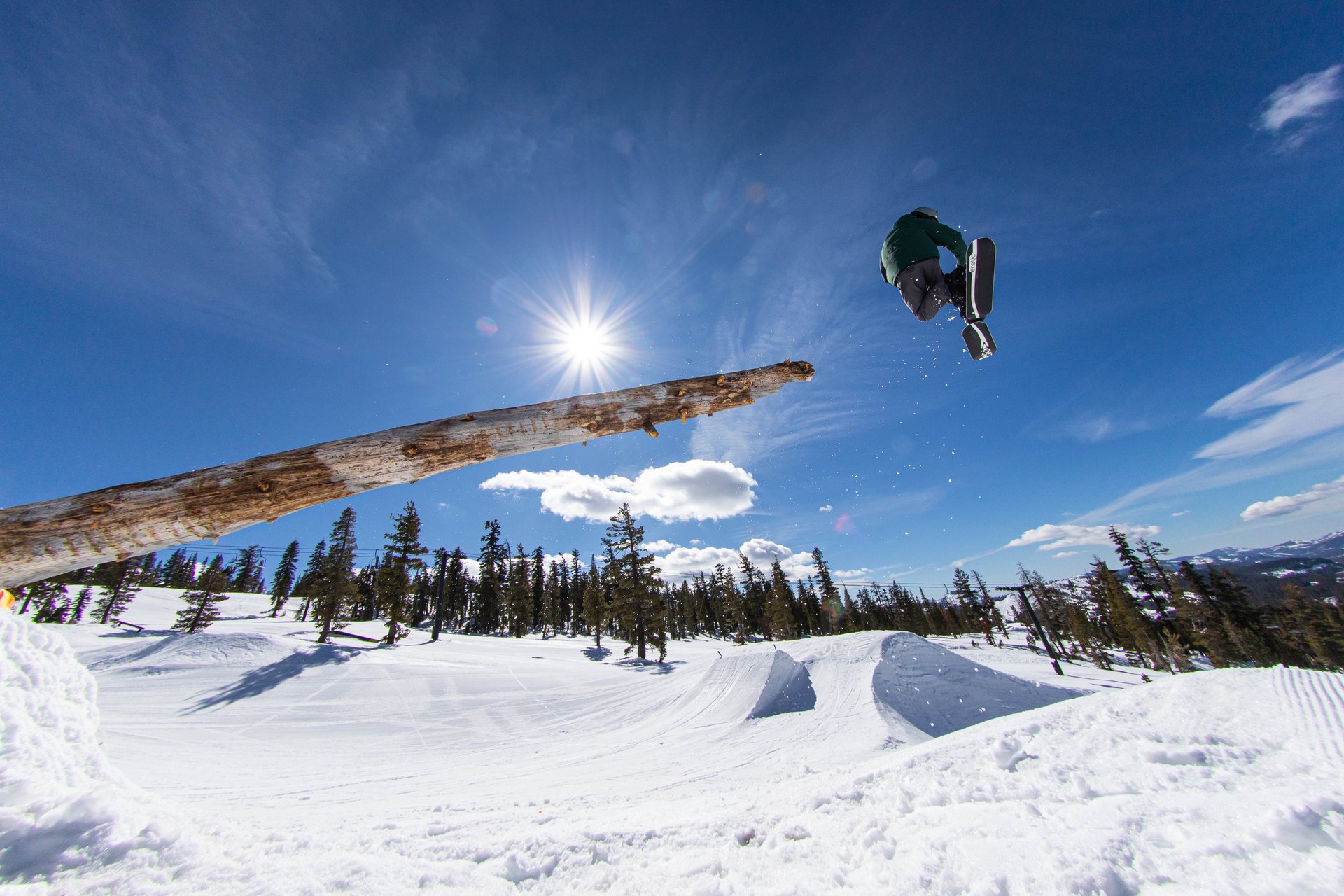 an abstract photo of a curved building with a blue sky in the background