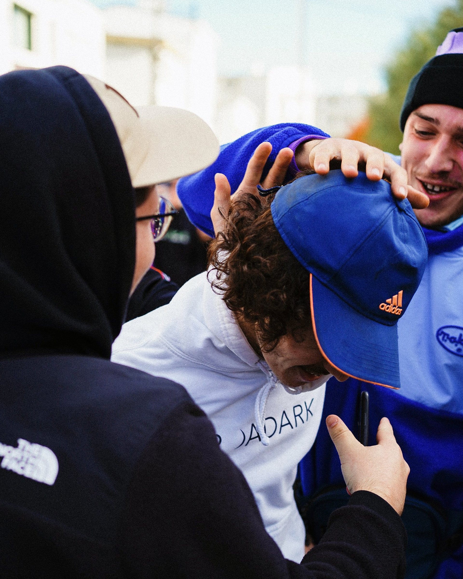 an abstract photo of a curved building with a blue sky in the background