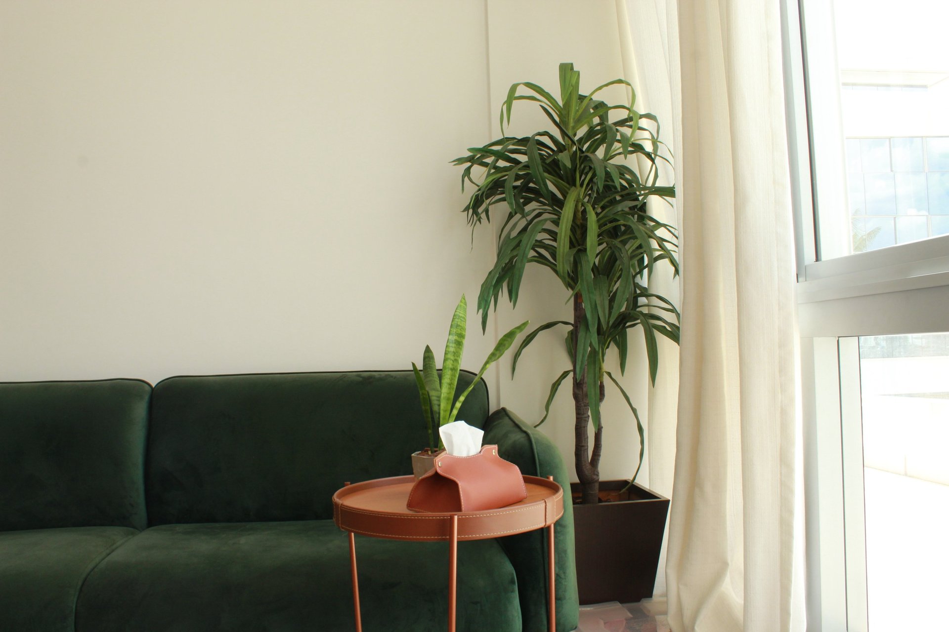 black and brown leather padded tub sofa