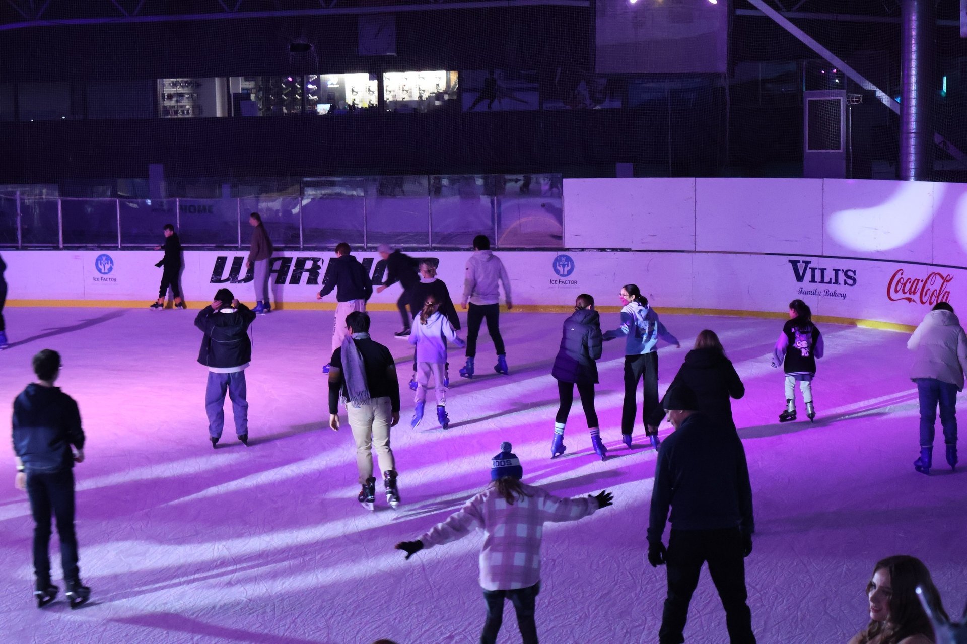 person wearing white leather ice skate