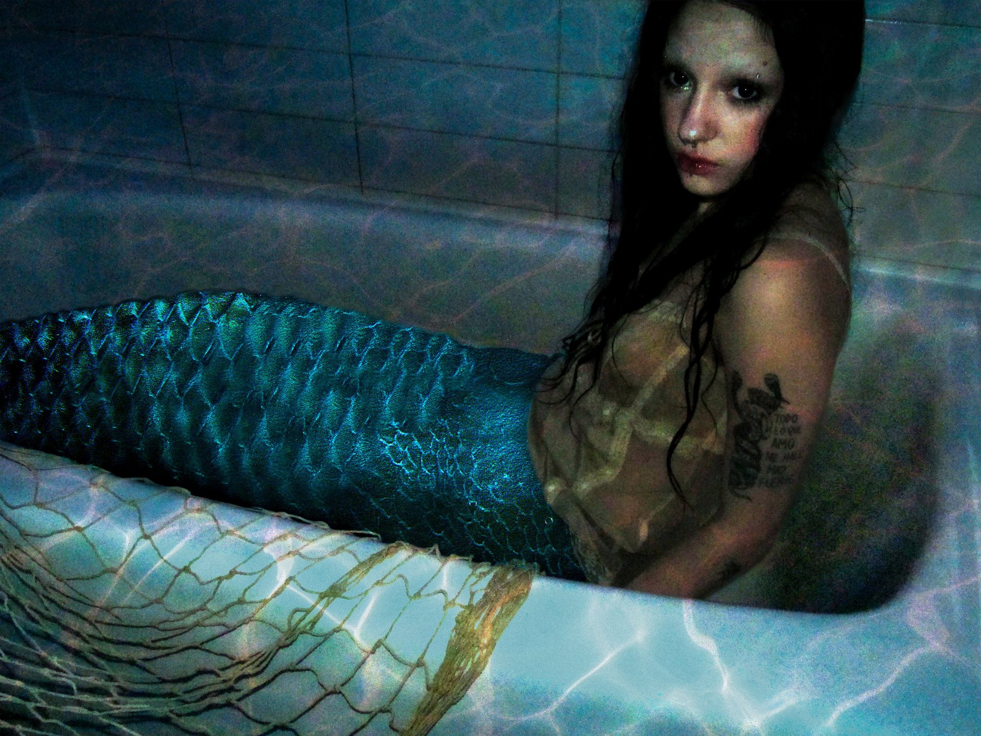 a close up of a black and brown abstract painting