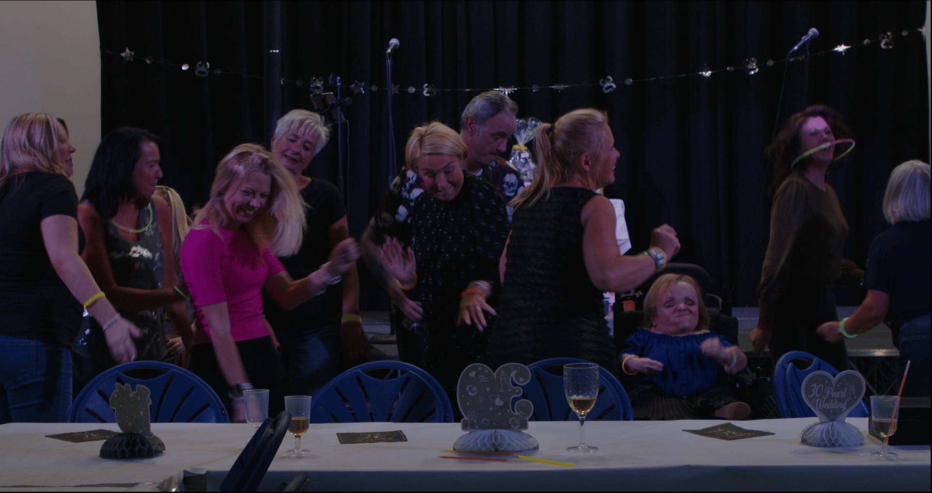 a group of people dancing in a room