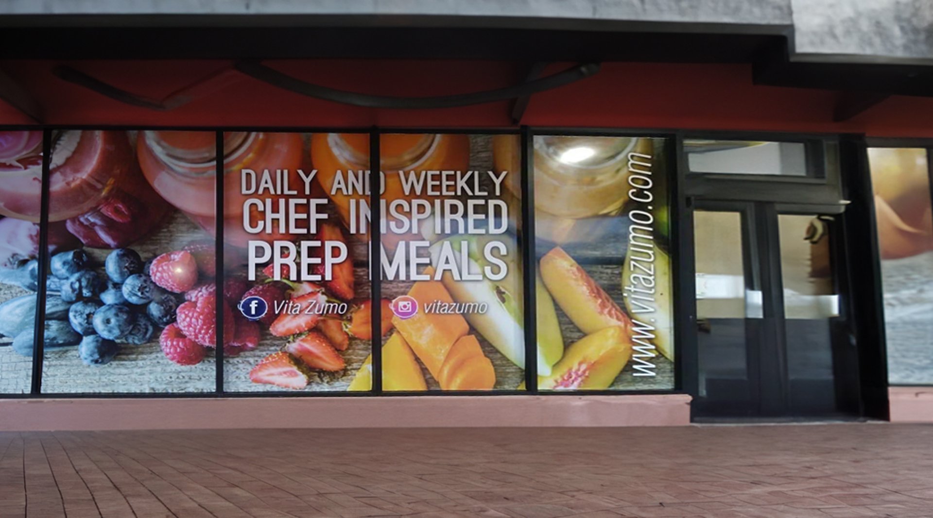 turned on MacBook on table beside iMac