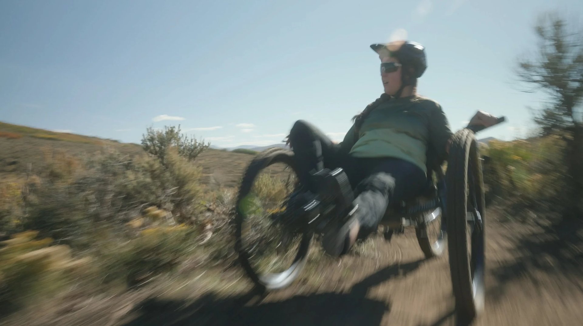 an abstract photo of a curved building with a blue sky in the background