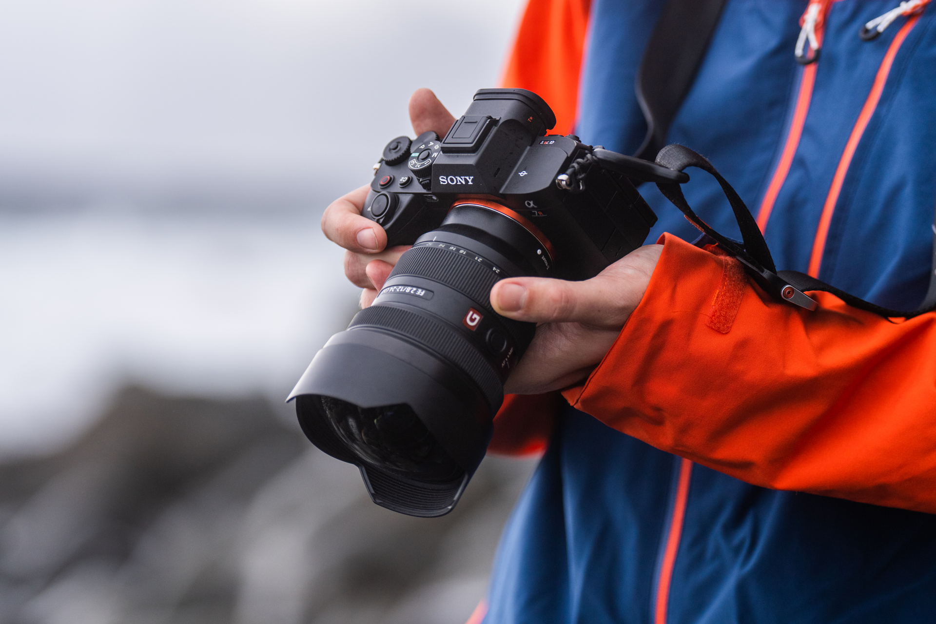 person holding black dslr camera