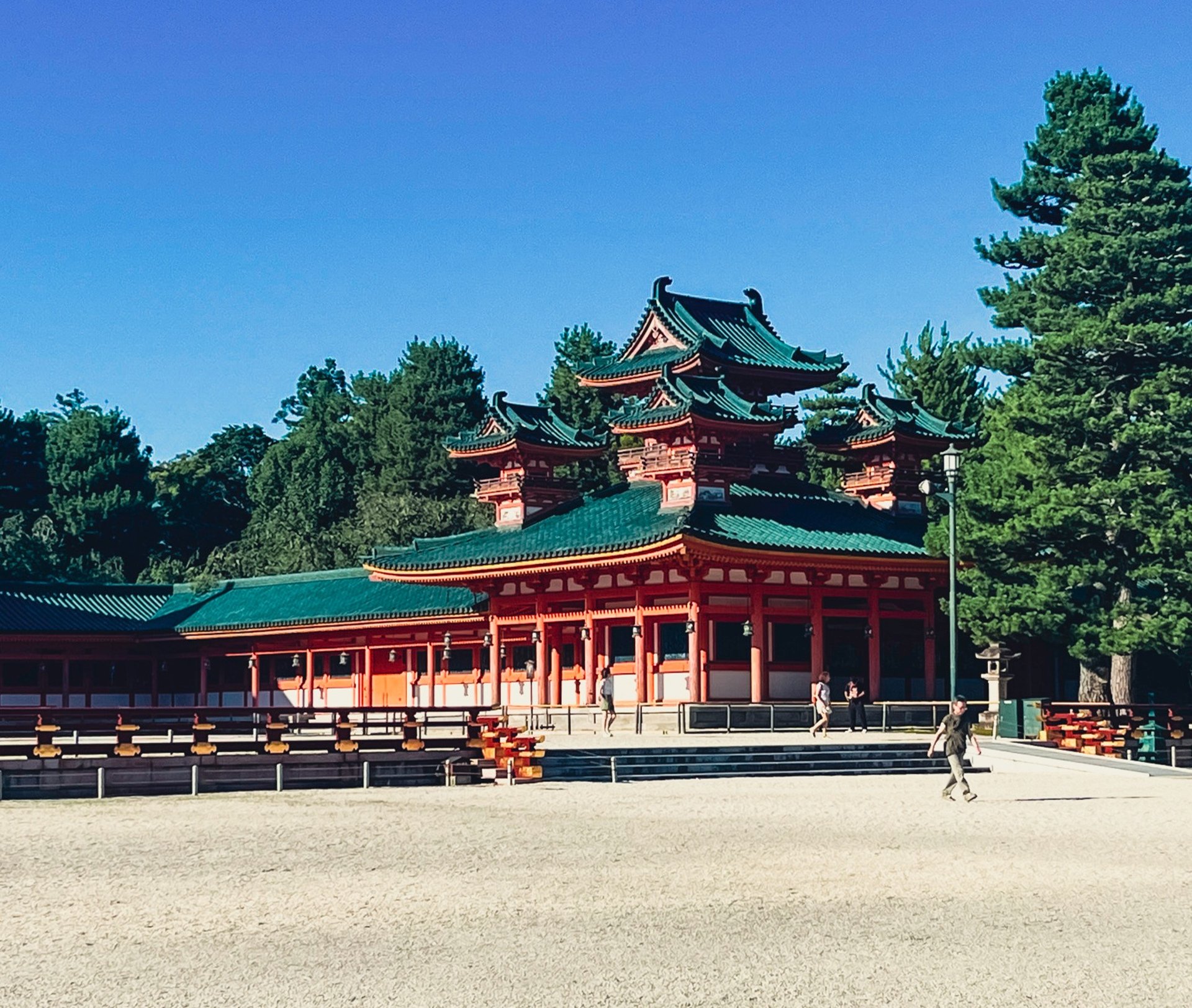 an abstract photo of a curved building with a blue sky in the background