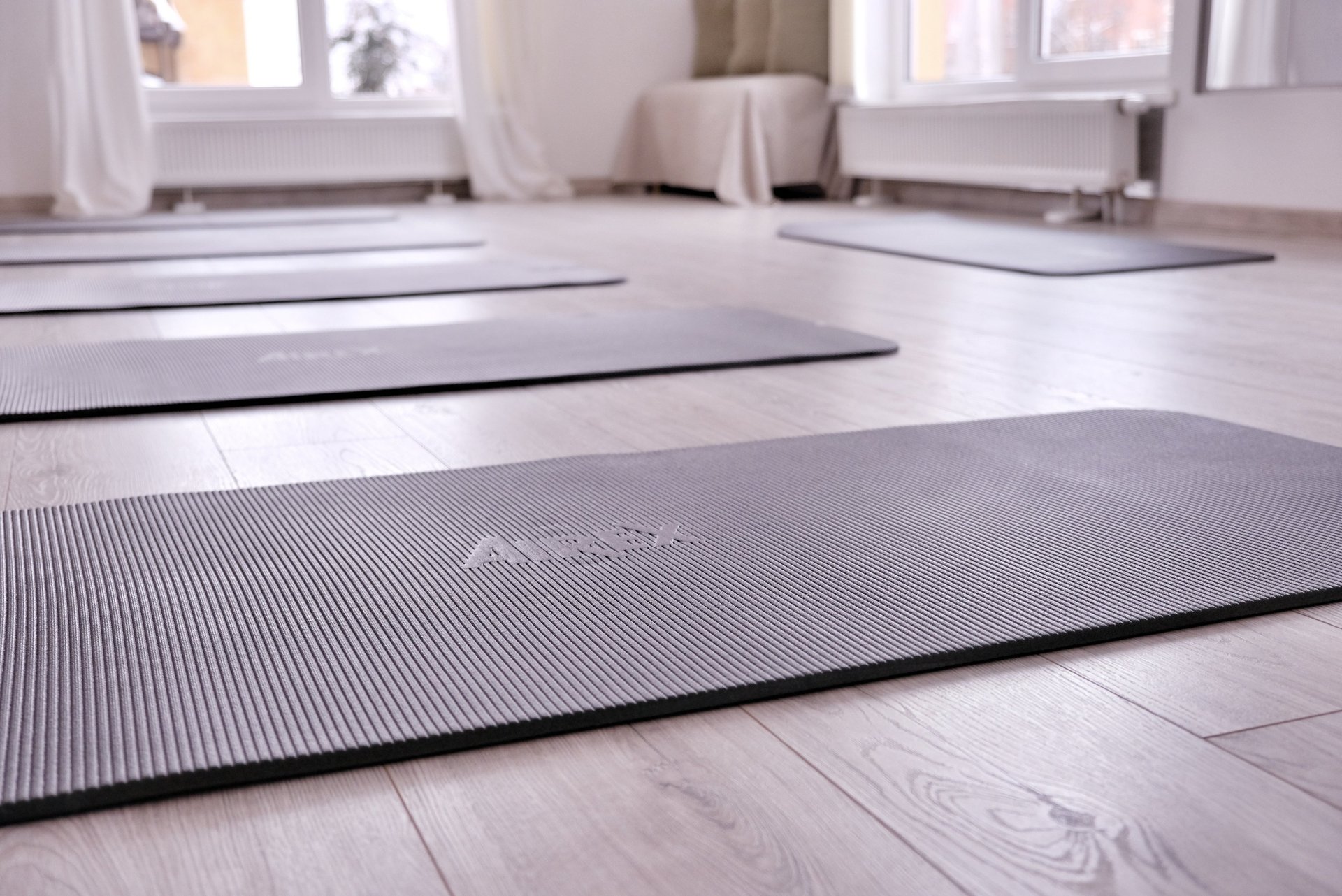 a person standing on a yoga mat on the floor