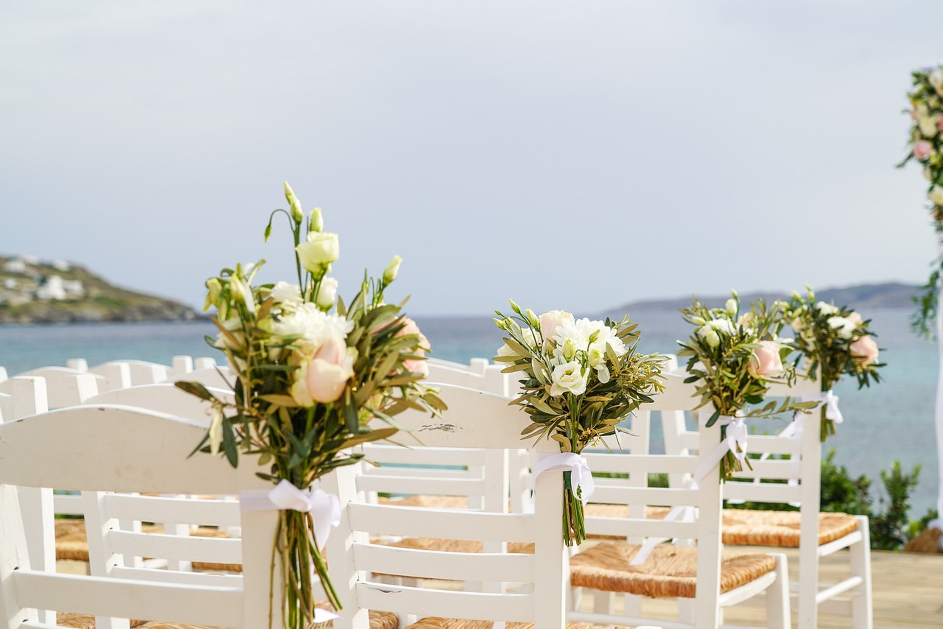 a set dining table with white chairs