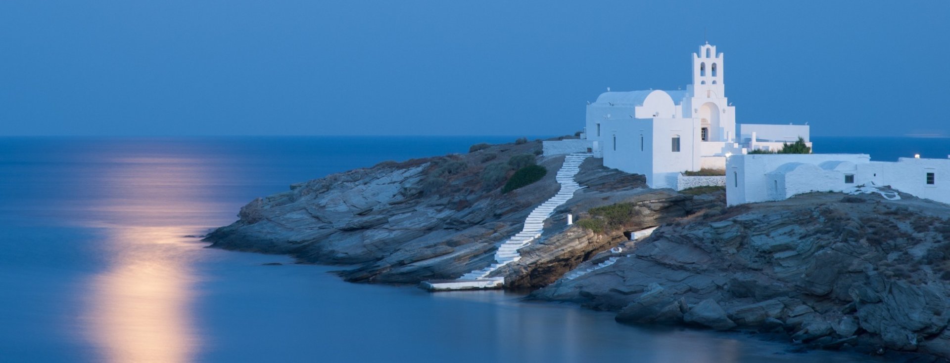 woman wearing yellow long-sleeved dress under white clouds and blue sky during daytime