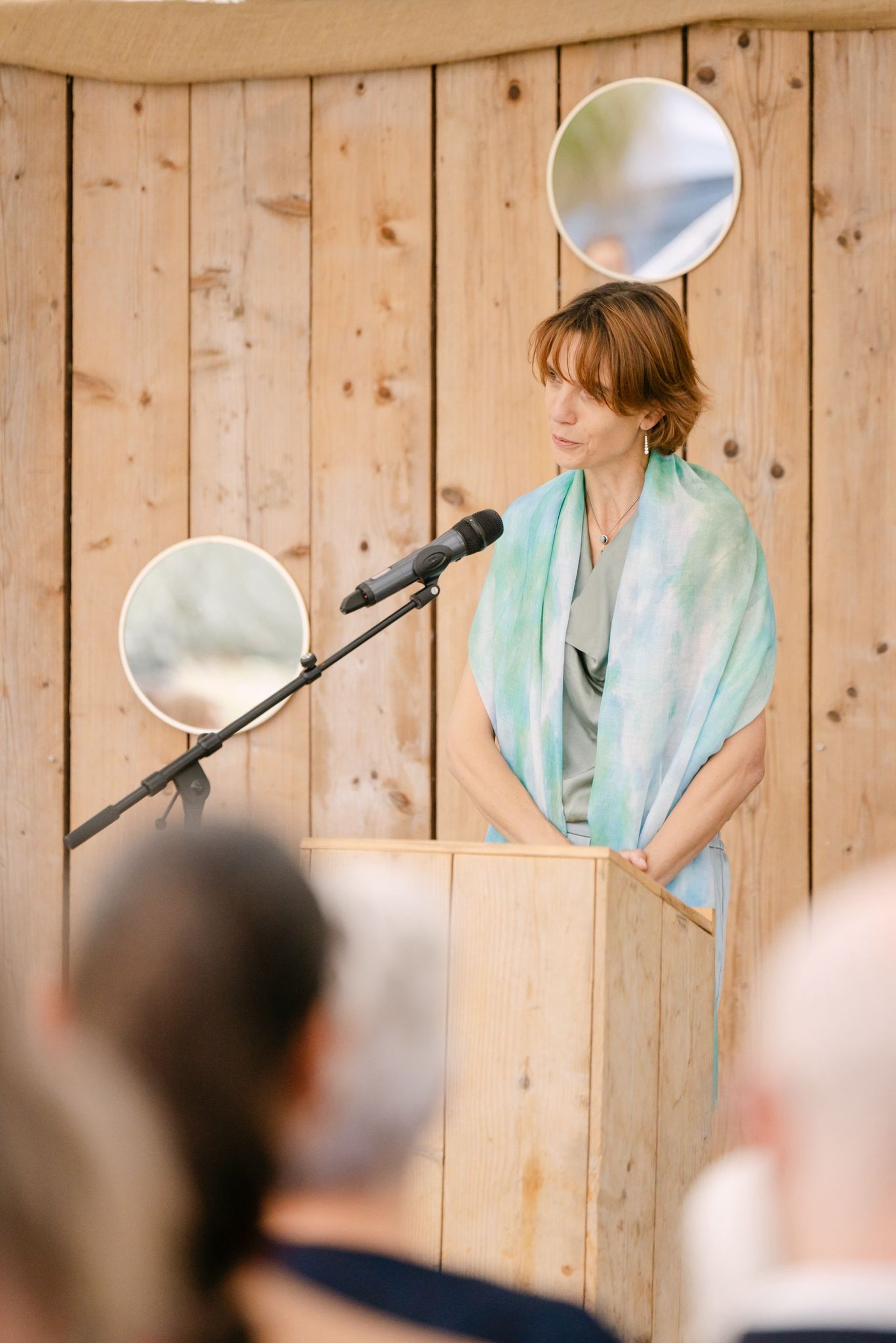 an abstract photo of a curved building with a blue sky in the background