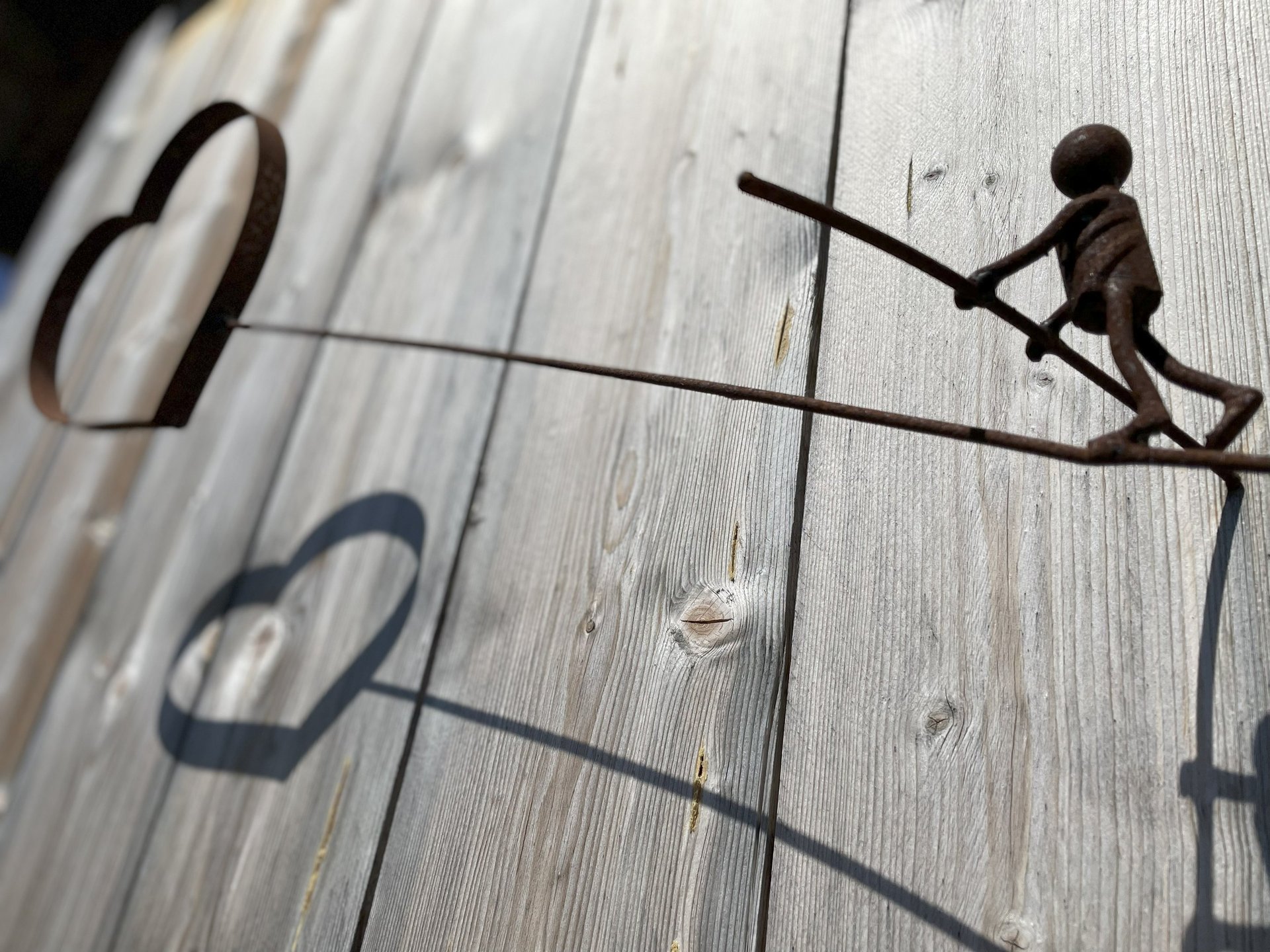 an abstract photo of a curved building with a blue sky in the background