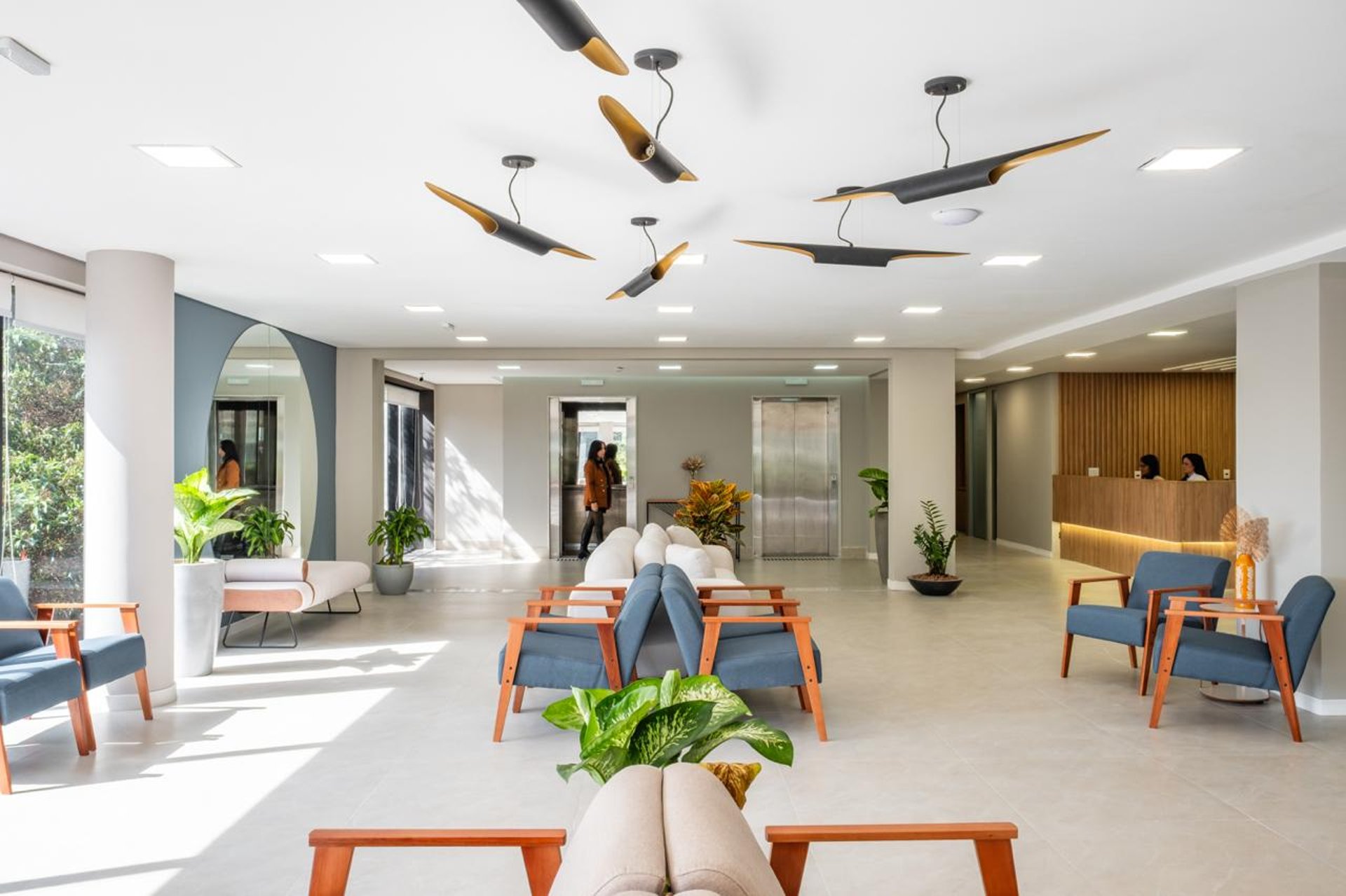 an abstract photo of a curved building with a blue sky in the background
