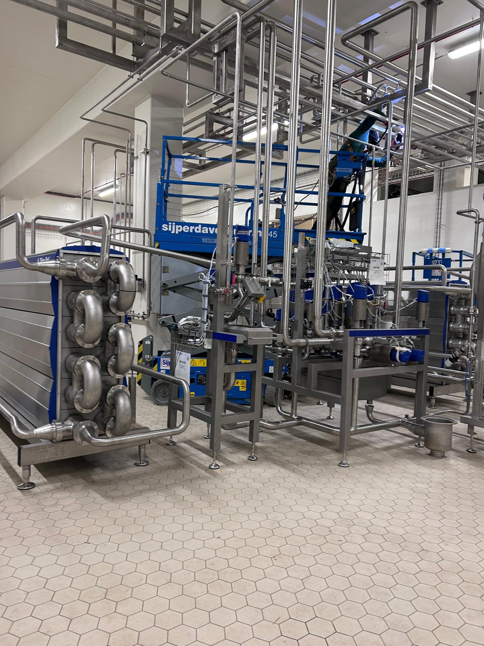 woman wearing yellow long-sleeved dress under white clouds and blue sky during daytime