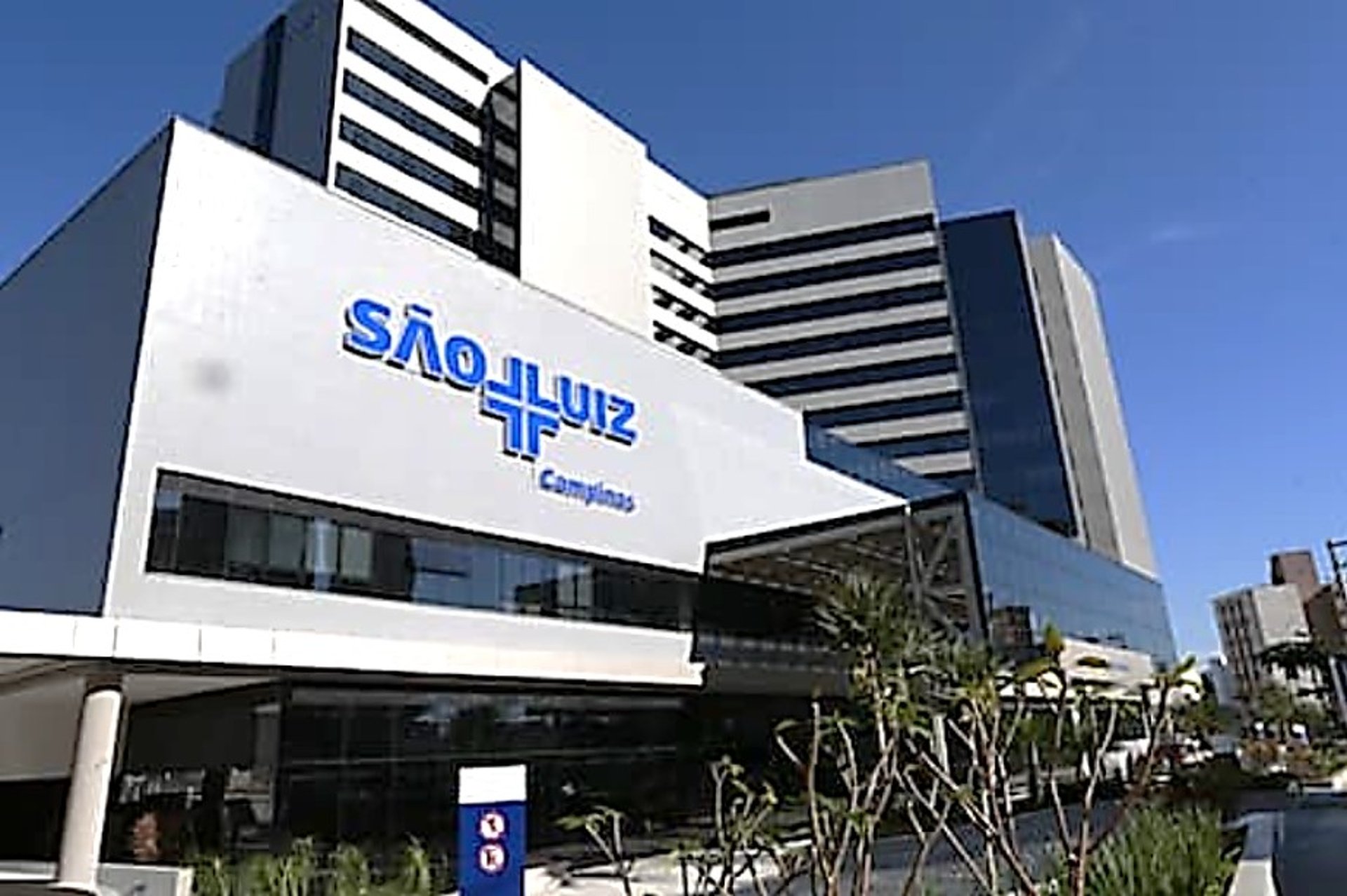 woman wearing yellow long-sleeved dress under white clouds and blue sky during daytime