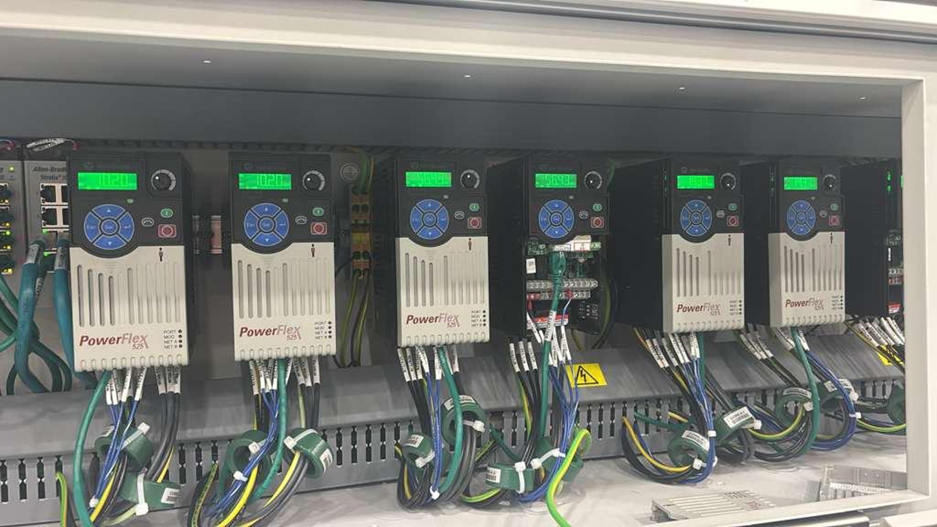 an abstract photo of a curved building with a blue sky in the background