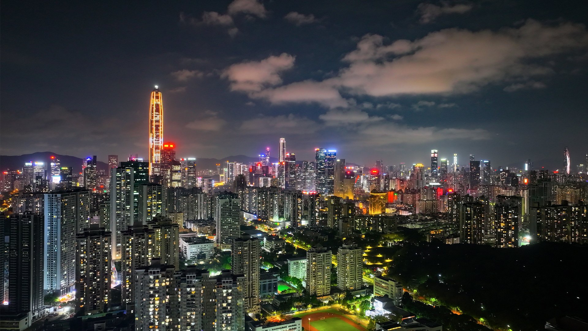 an abstract photo of a curved building with a blue sky in the background