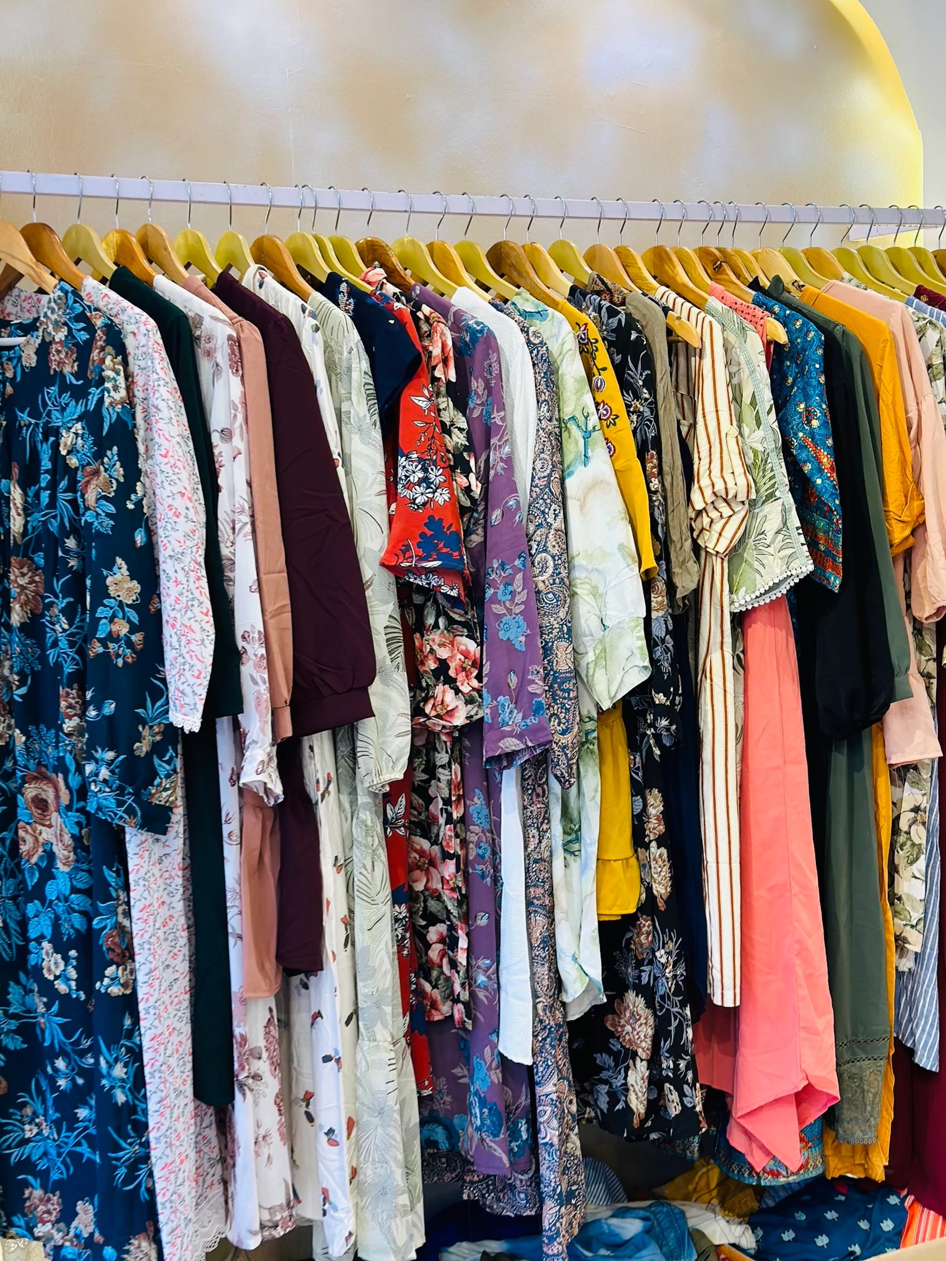 woman wearing yellow long-sleeved dress under white clouds and blue sky during daytime