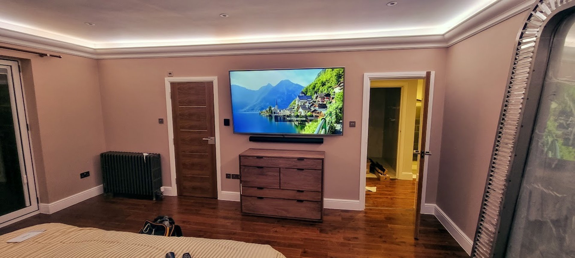 Big Screen TV mounted on a feature wall in a living room