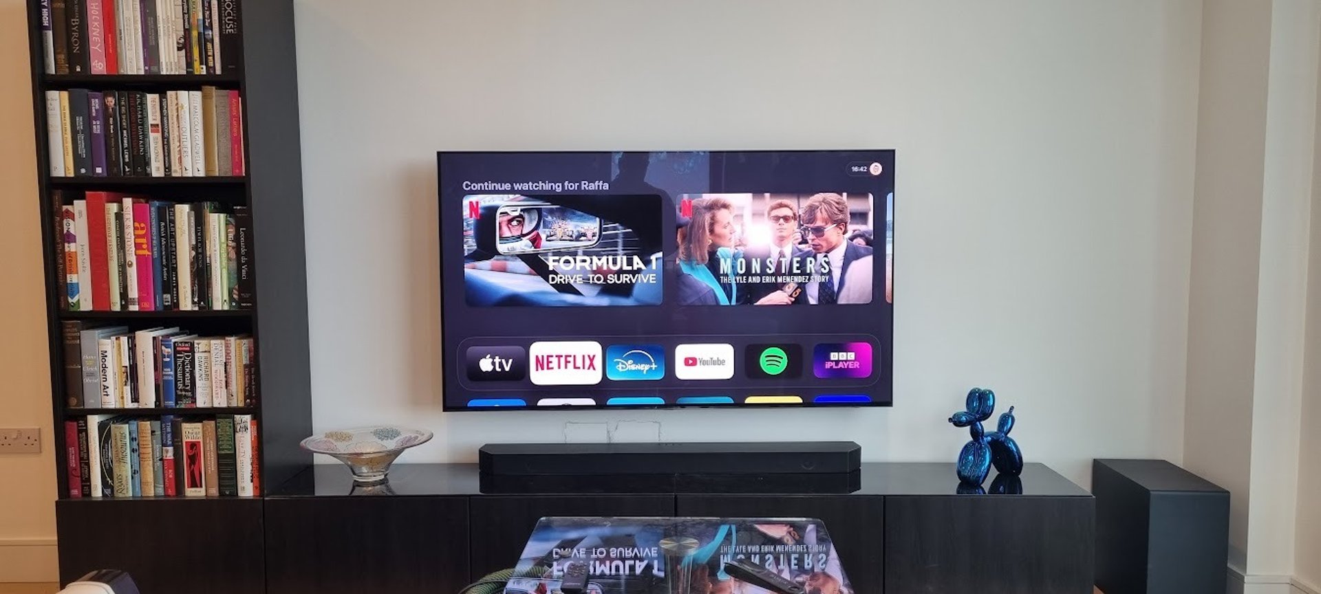 Big Screen TV mounted on a feature wall in a living room